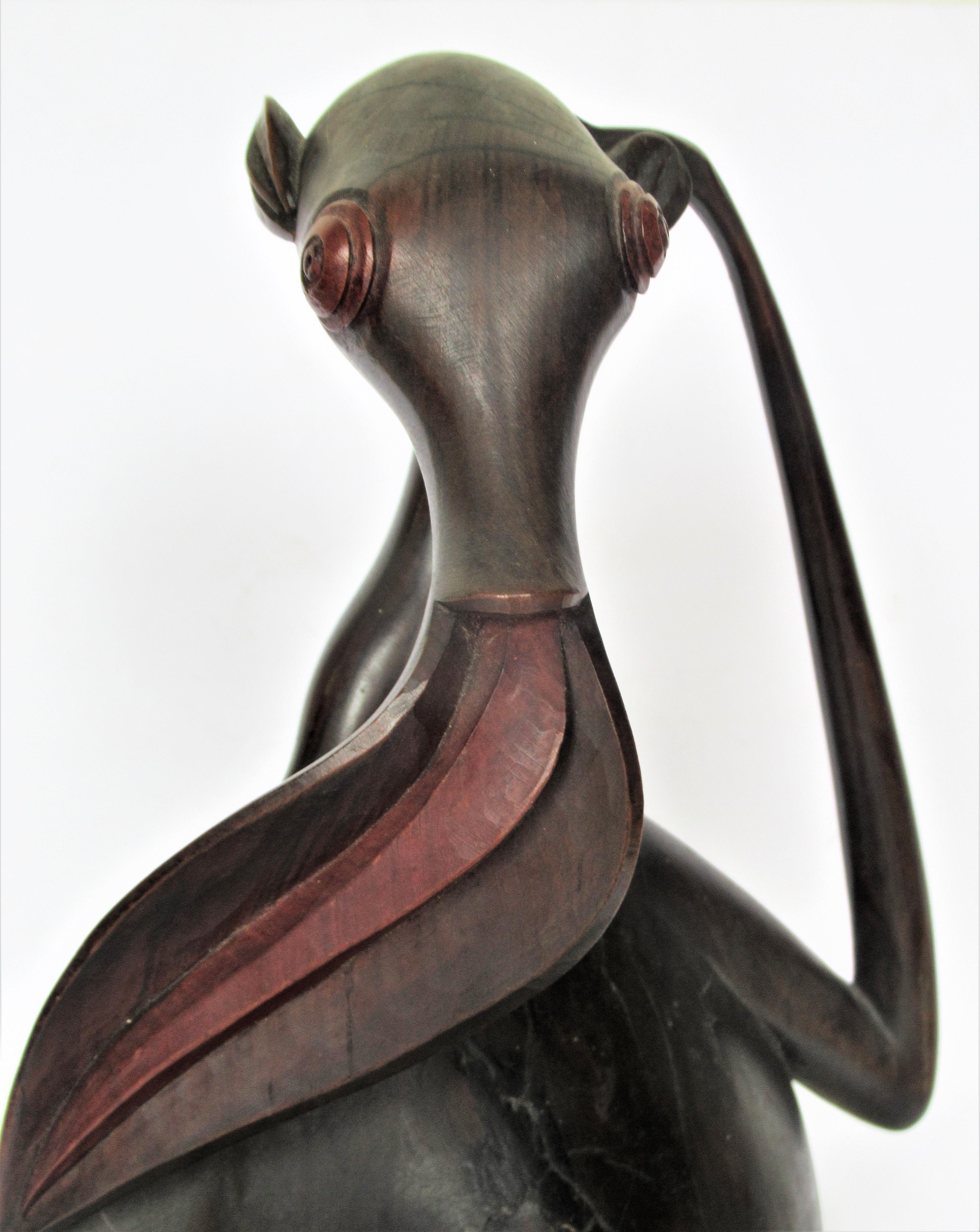 Makonde modernist sculpture of an Aardvark / Antbear in exceptional finely carved blackwood and original red stained features w/ overall beautifully aged old surface color patina. Tanzania / first half of the 20th century. A museum quality example