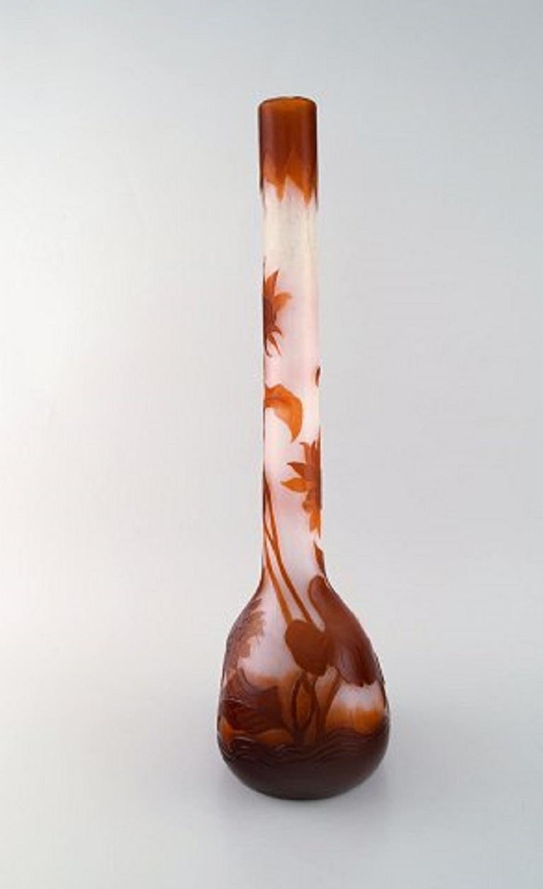 Early, monumental Emile Gallé vase in clear frosted and overlaid red-brown art glass carved with motifs in the form of flowers and leaves, 1890s.
Measures: 50.5 x 18 cm.
Signed at the bottom: Gallé, deposé.
In perfect condition.
