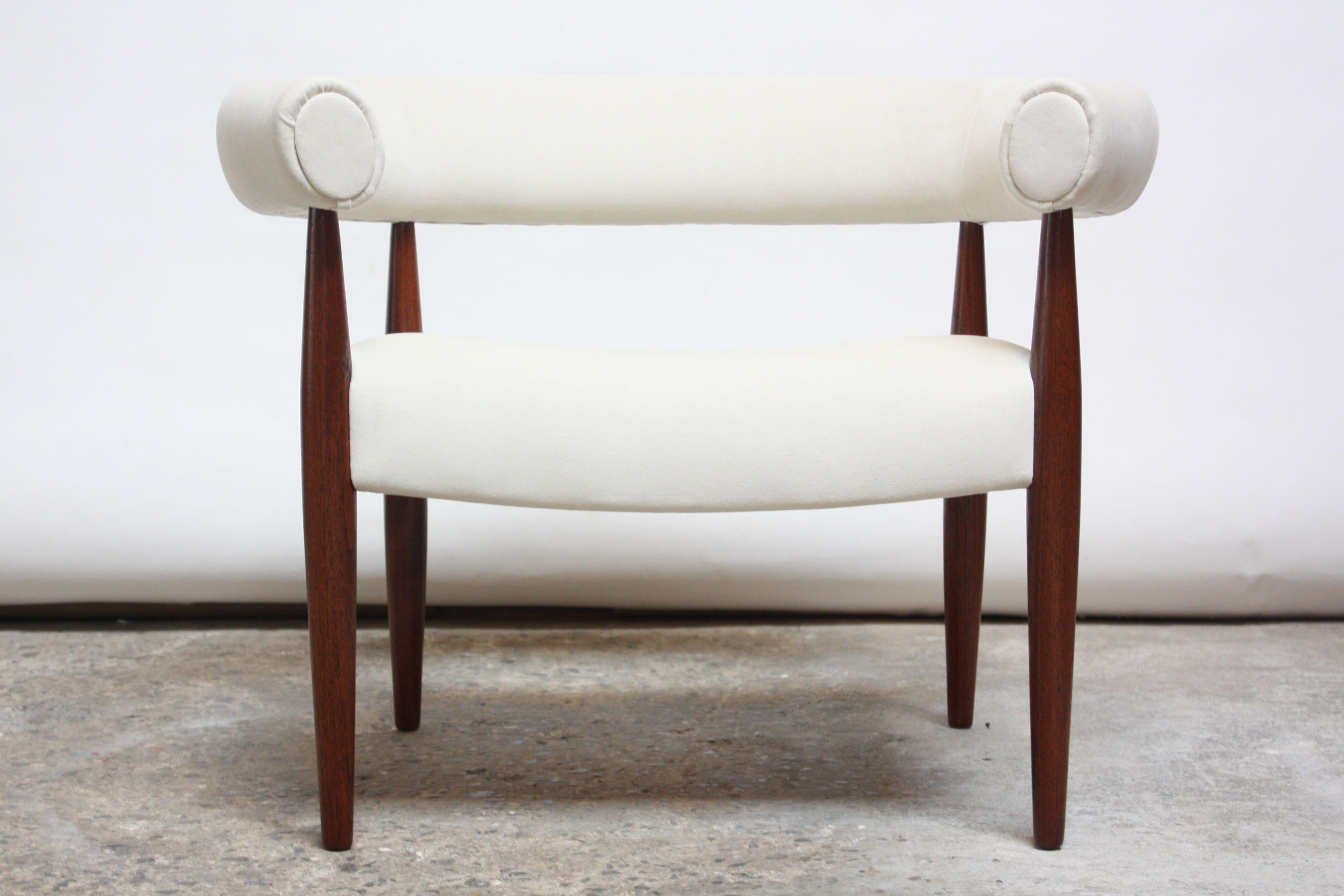 Original Danish 'Ring Chair' often referred to as the 'Pølse Stol' (Sausage Chair) designed by Nanna and Jørgen Ditzel for Kold Savvaerk in 1958. An early example (model 114) in stained teak recovered in an off-white suede (the foam has additionally