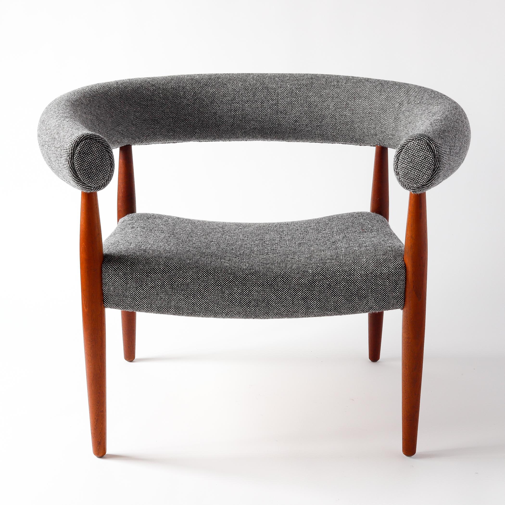 This midcentury Danish Modern upholstered armchair was designed by Nanna Ditzel (1923-2005) for Kold Savvaerk in 1958 and was called a Pølsestol, or sausage chair (it is also called a ring chair). Working with her husband Jørgen through the 1940s