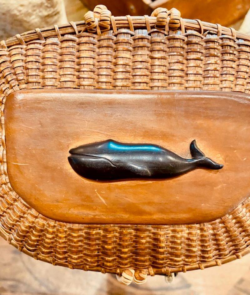 Early Nantucket Creel Shaped Purse by Jose Formoso Reyes, circa 1950s. An early free woven basket (made without a mold) that features a pentagonal creel-shaped pine bottom and maple top plate, carved swing handle, rattan staves, and cane weave that