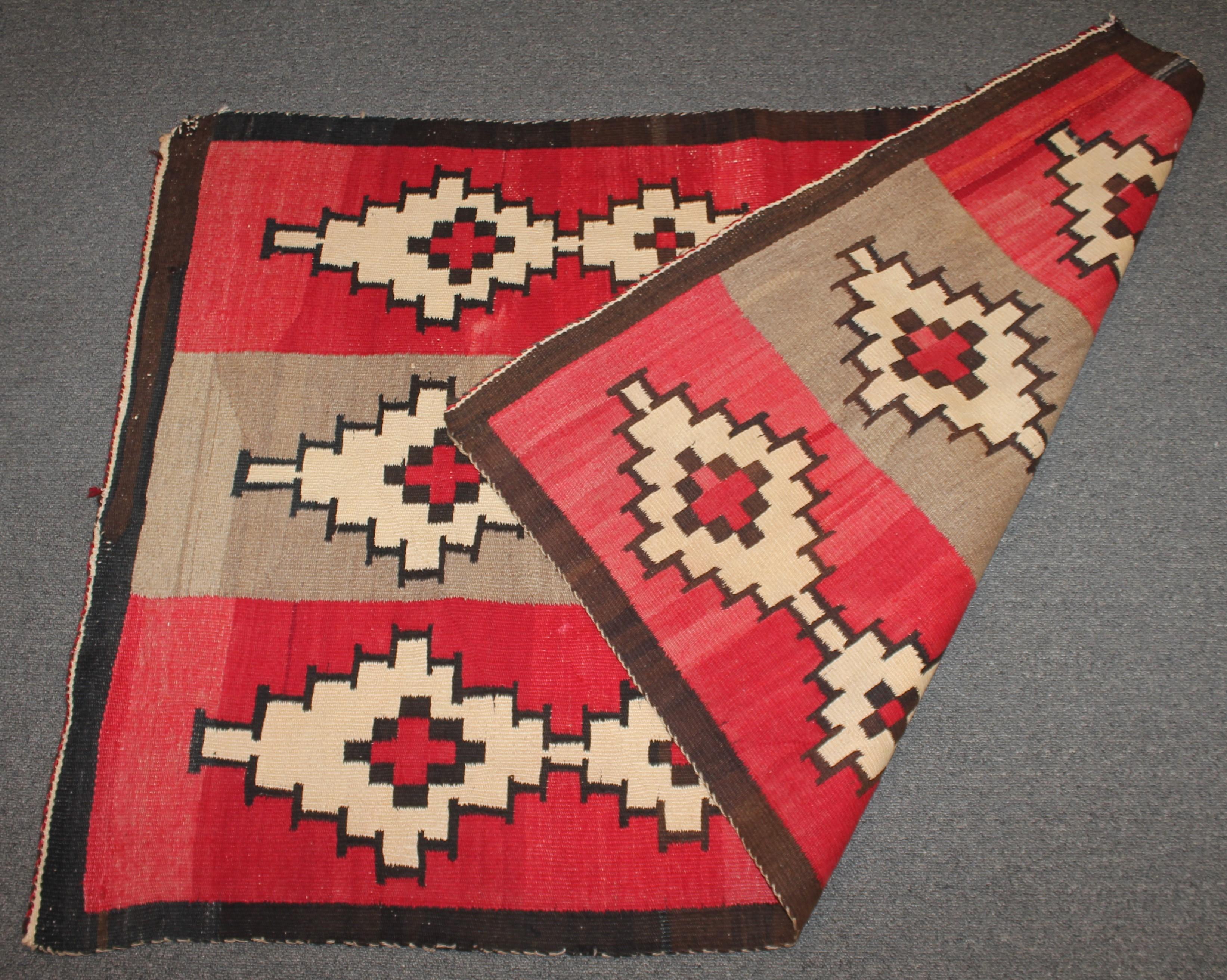 This early Navajo Indian weaving is in very good condition with minor fade throughout.