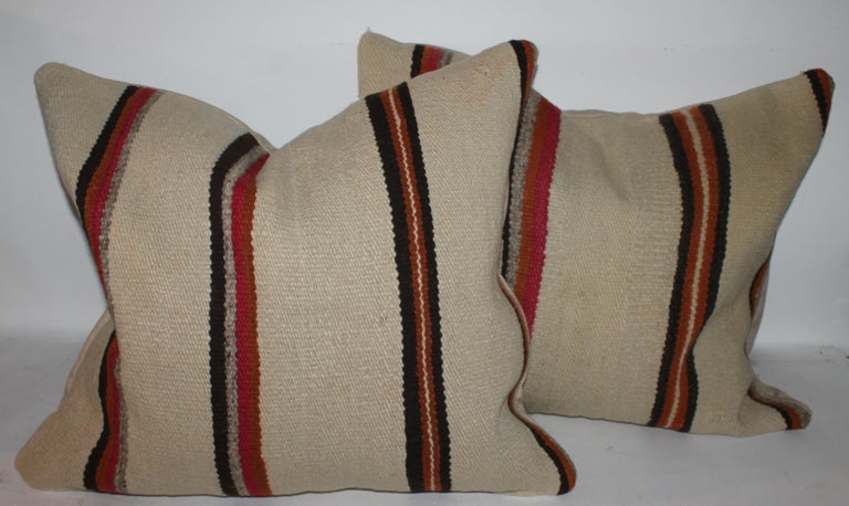 Early 20th c Navajo Indian weaving large pillows. This pair of saddle blanket weaving pillows are in fine condition.