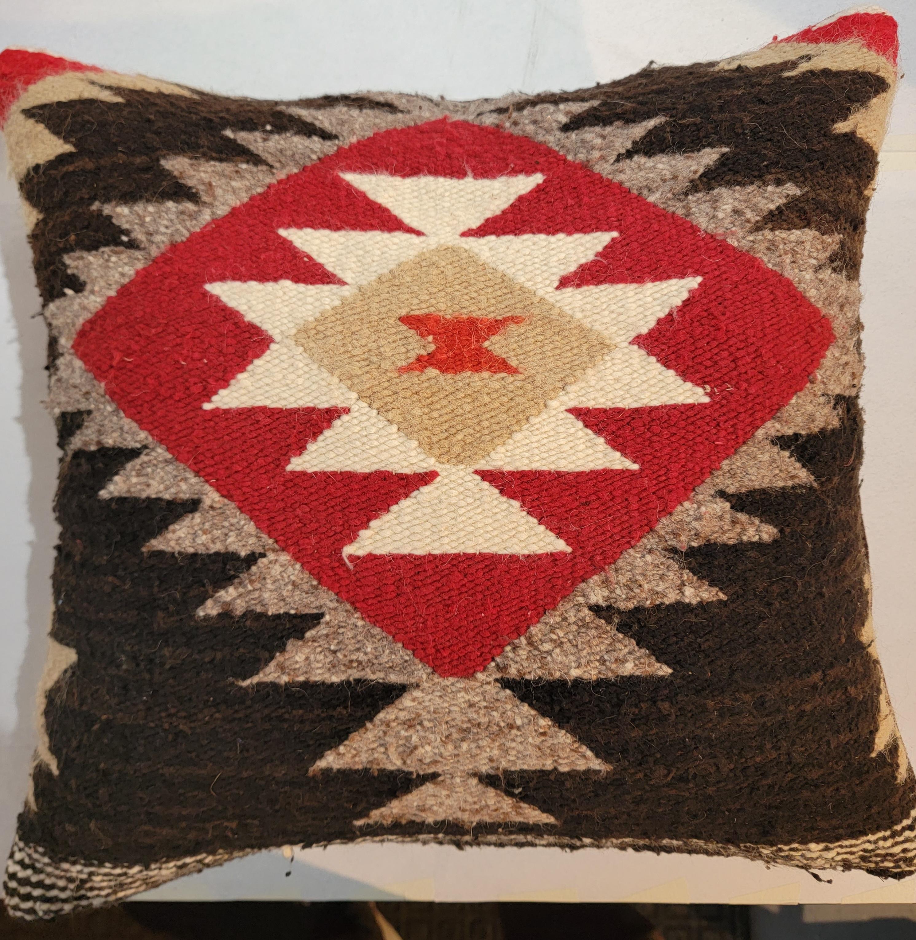 These Navajo Indian weaving pillows are in pristine condition. They are from a Indian weaving - saddle blanket pillows.The pair of pillows have mohair backings in mint condition.