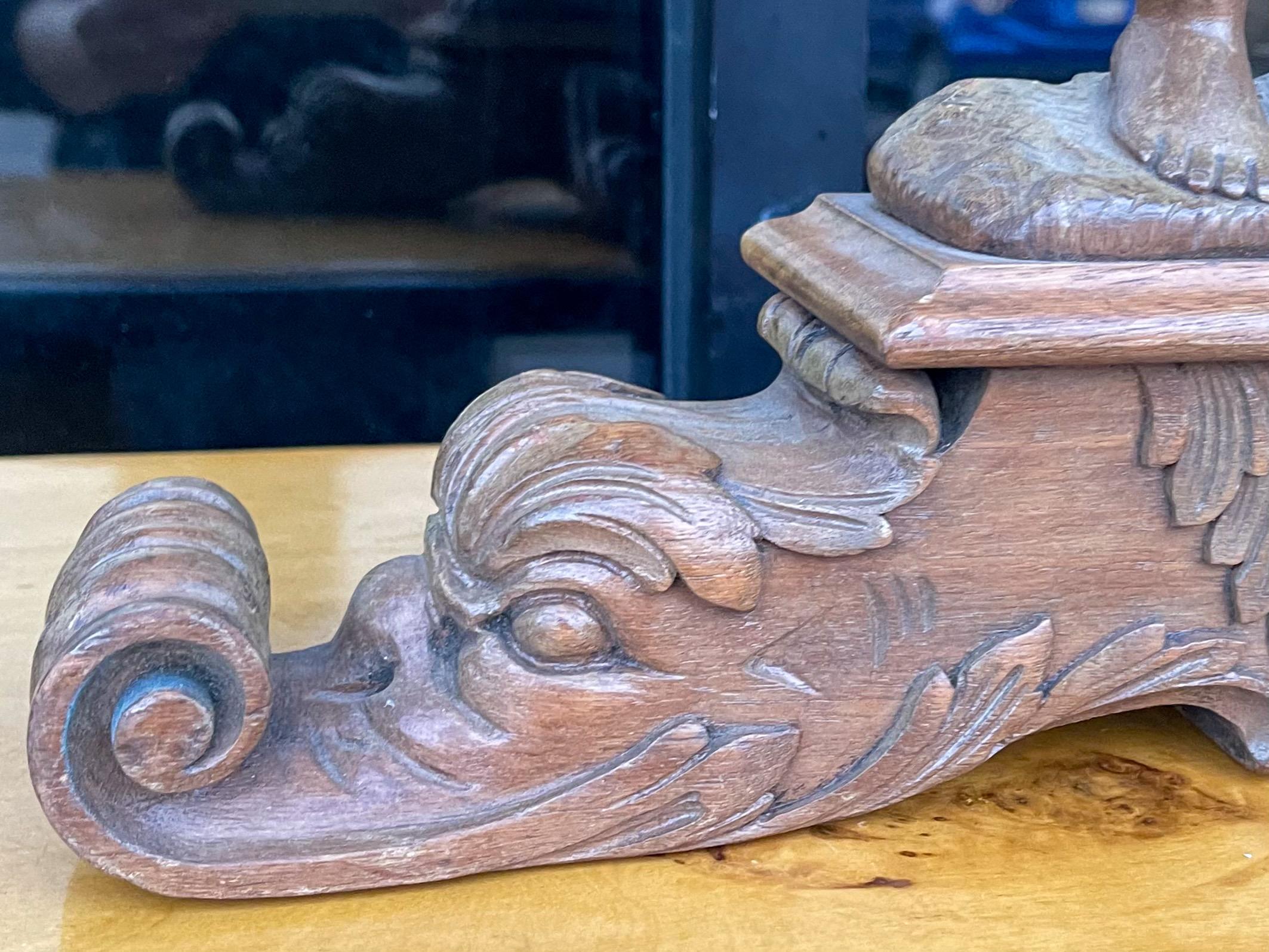  These are wonderful! They are a pair of Italian carved fruitwood putti form side tables. They have neo-classical styling as indicated by the carved dolphin form bases. They date to the earlier part of the 20th century and are in very good condition.