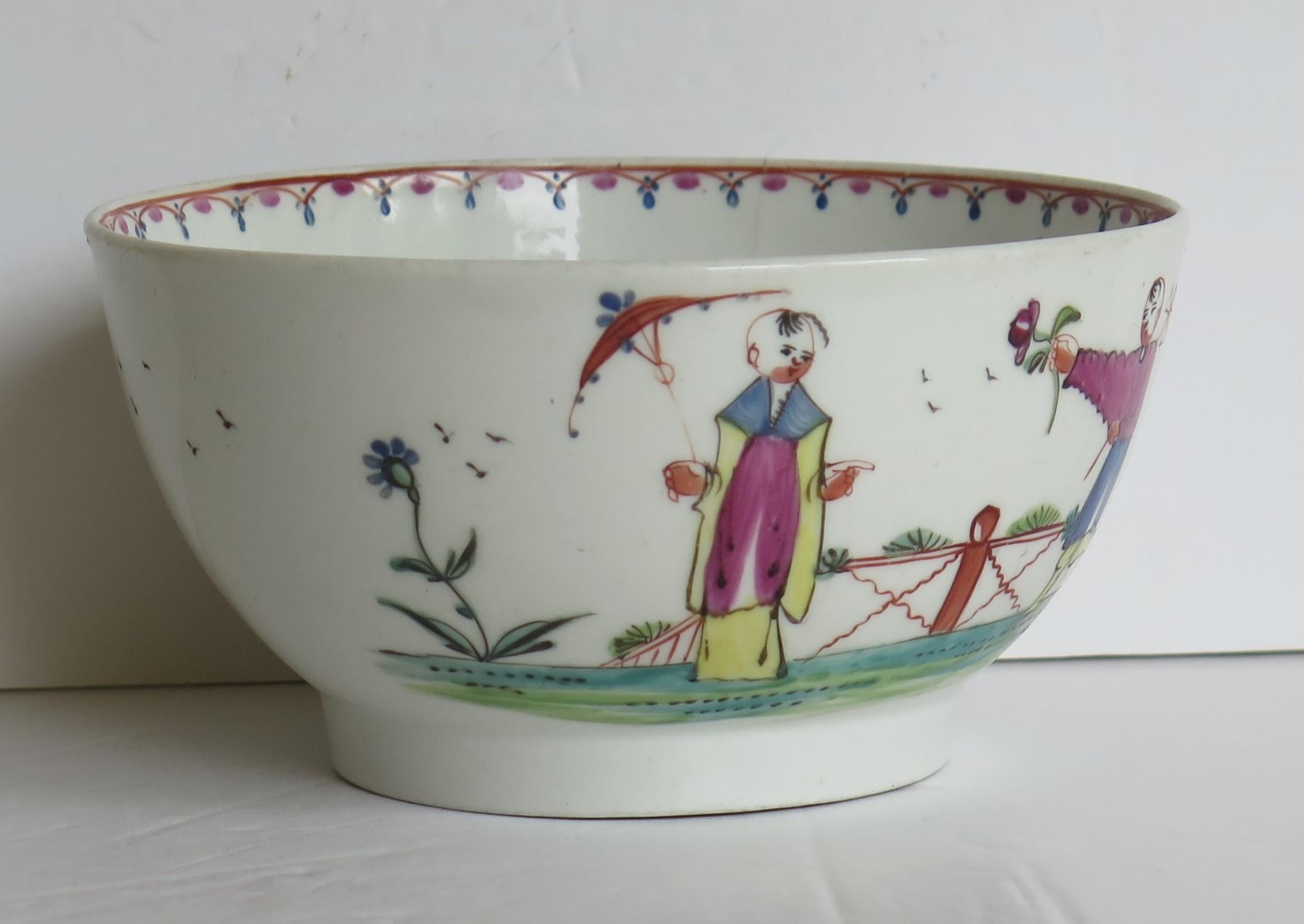 This is a hard paste porcelain waste or slop bowl by New Hall in a hand painted Chinoiserie figure pattern number 20, dating to the late 18th century, Circa 1790.

The bowl is well potted on a mid depth foot. 

The decoration is hand-painted