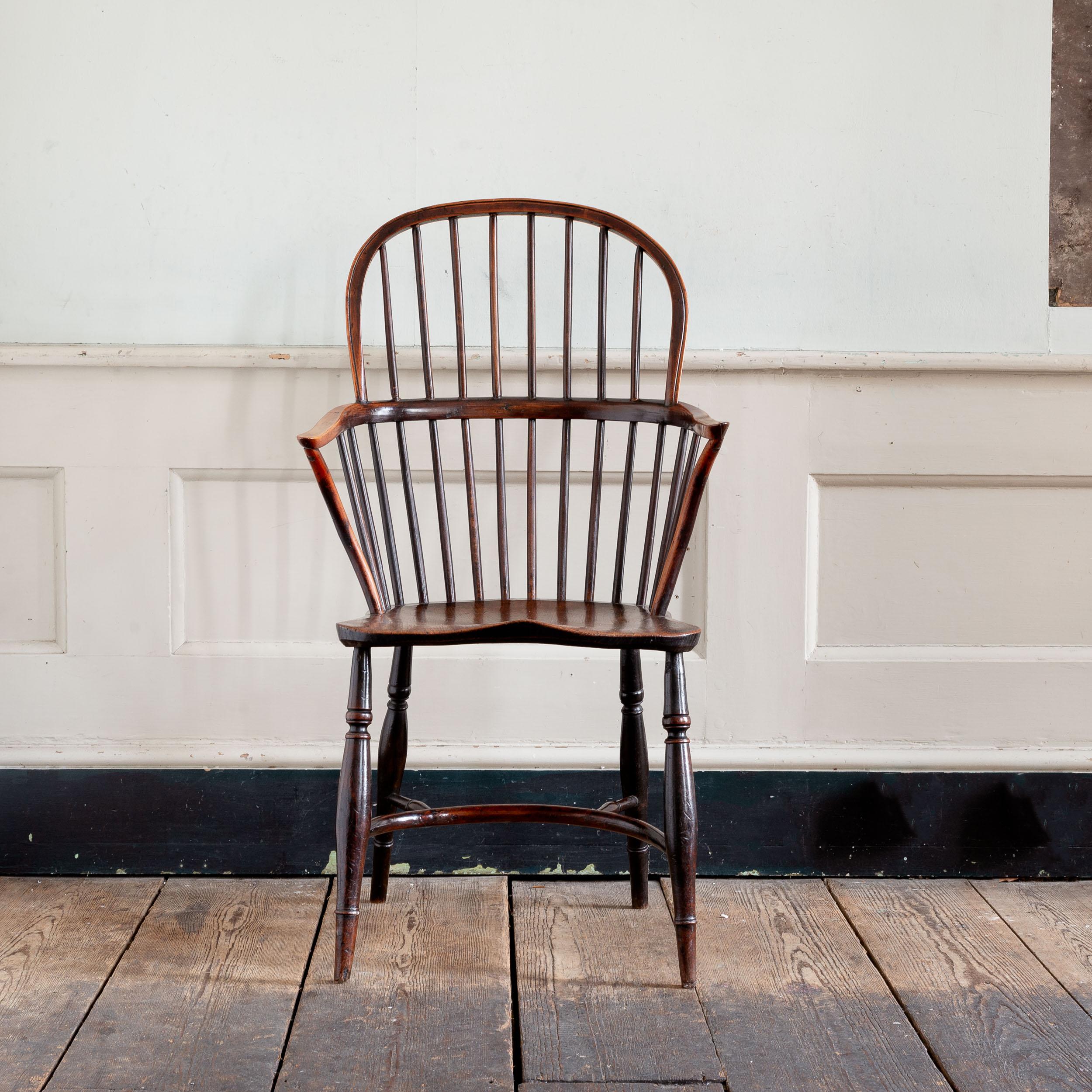 Early 19th century Windsor armchair, Thames Valley, Yew, with Elm seat. A pleasing, simple and unfussy example of English Country furniture in a variety of indigenous timbers, with refined turned elements to the under-carriage and well patinated