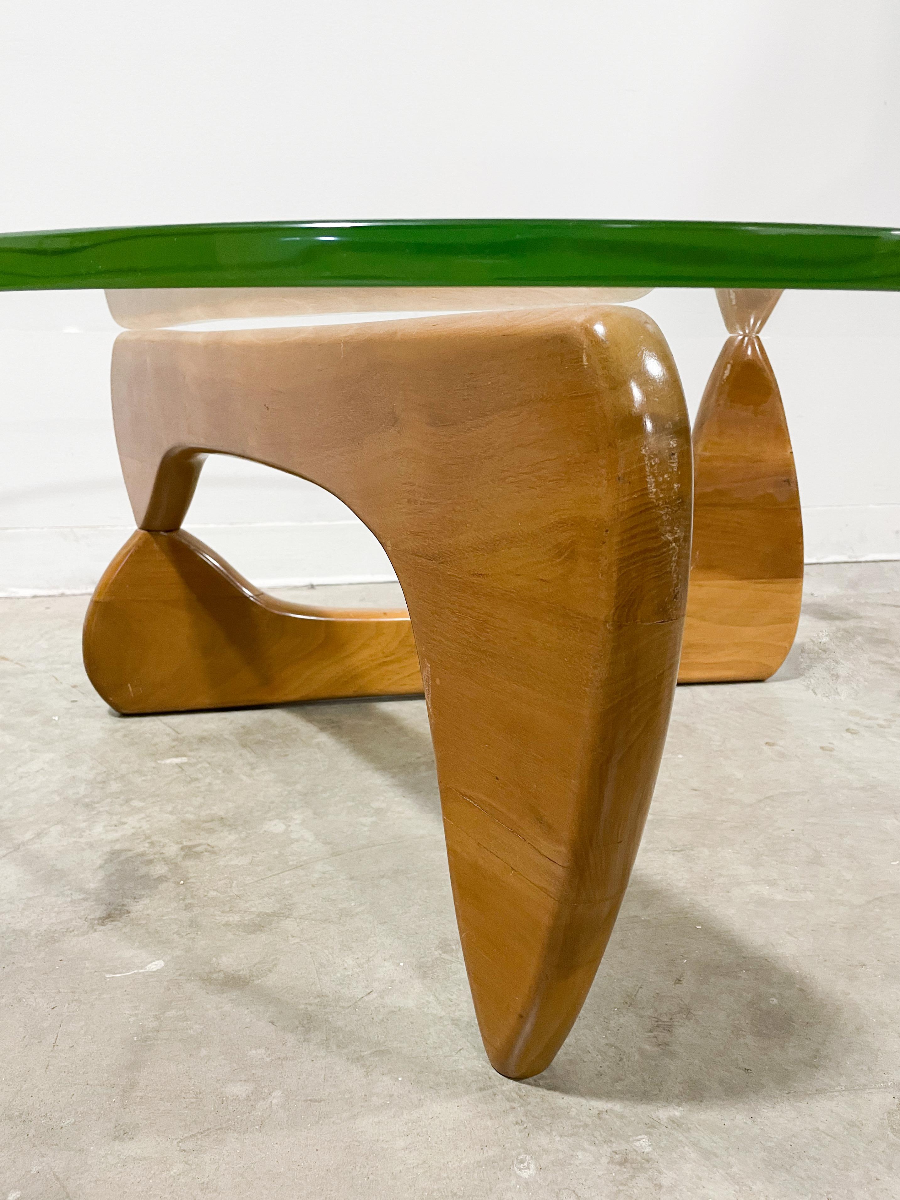 Late 1940s/early 1950s production of the world's most famous modern coffee table, designed by Isamu Noguchi and made by Herman Miller. Sculpture and function are one with the organic form base in solid walnut consisting of two matching halves simply