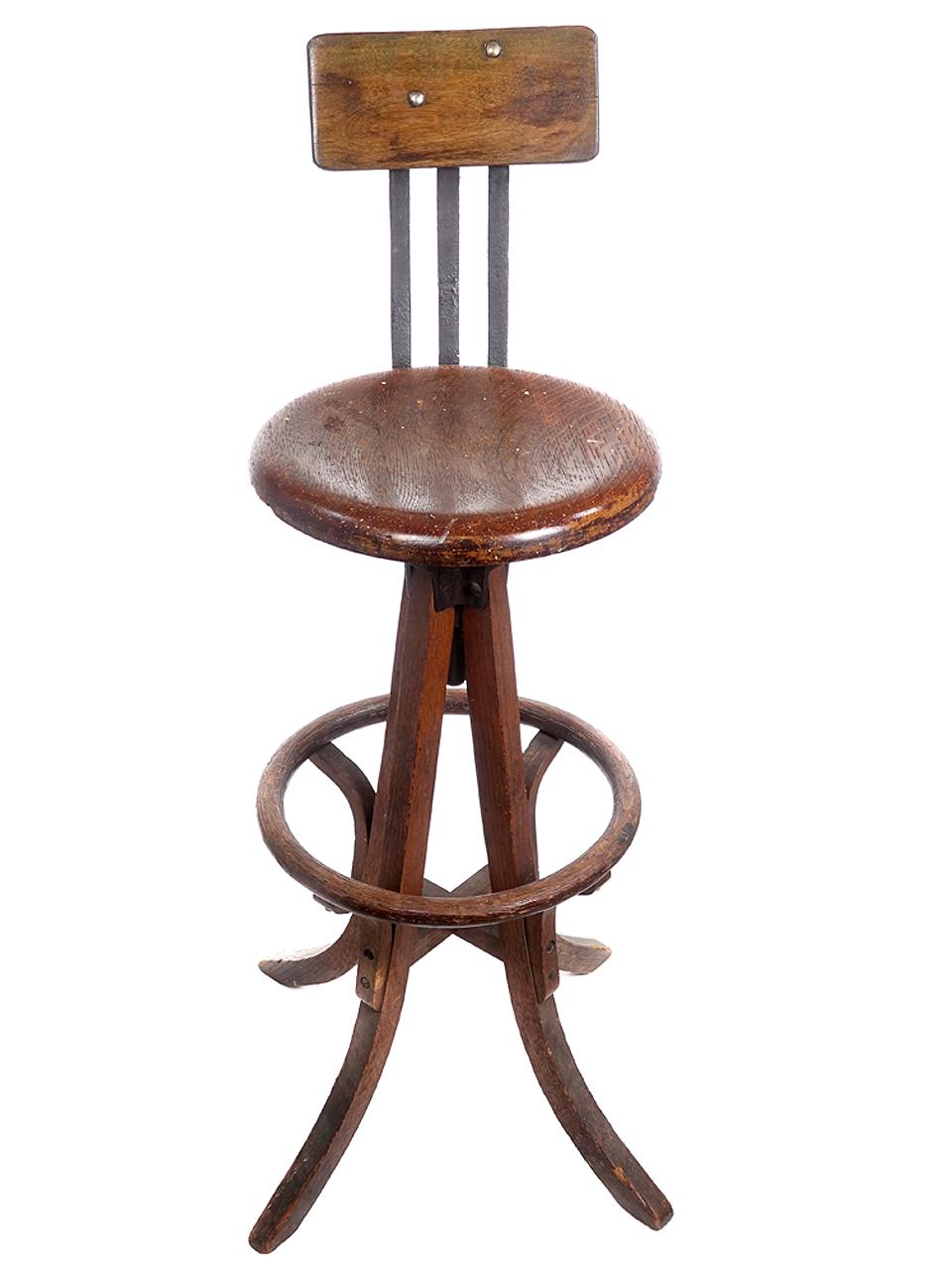 This is a beautiful single painters or draftsman's swivel stool. The back is oak and cast iron with a bentwood footrest. It has a nice old patina.