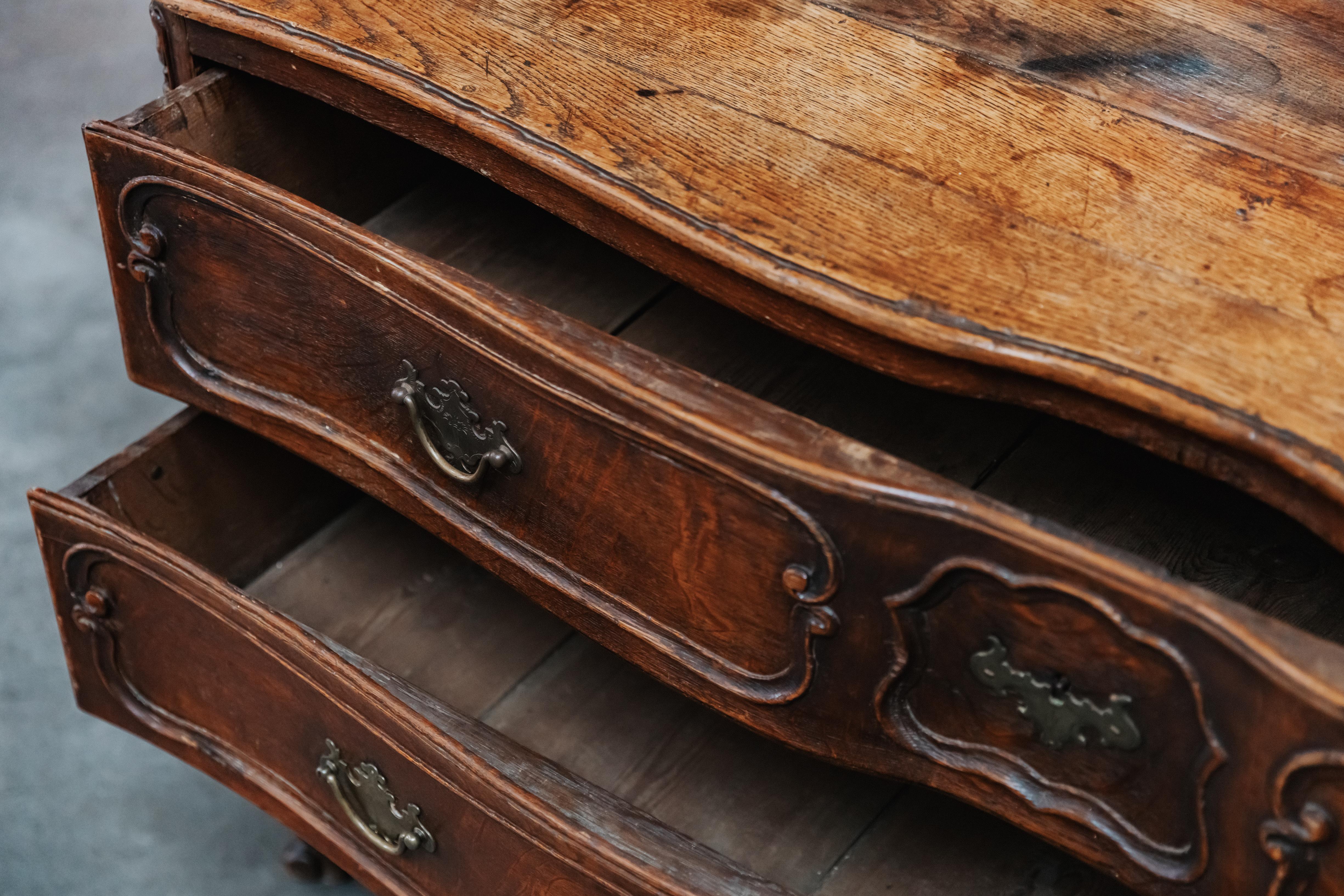 Early Oak Chest Of Drawers Form France, Circa 1800.  Solid oak construction with original hardware.  Great wear and use.