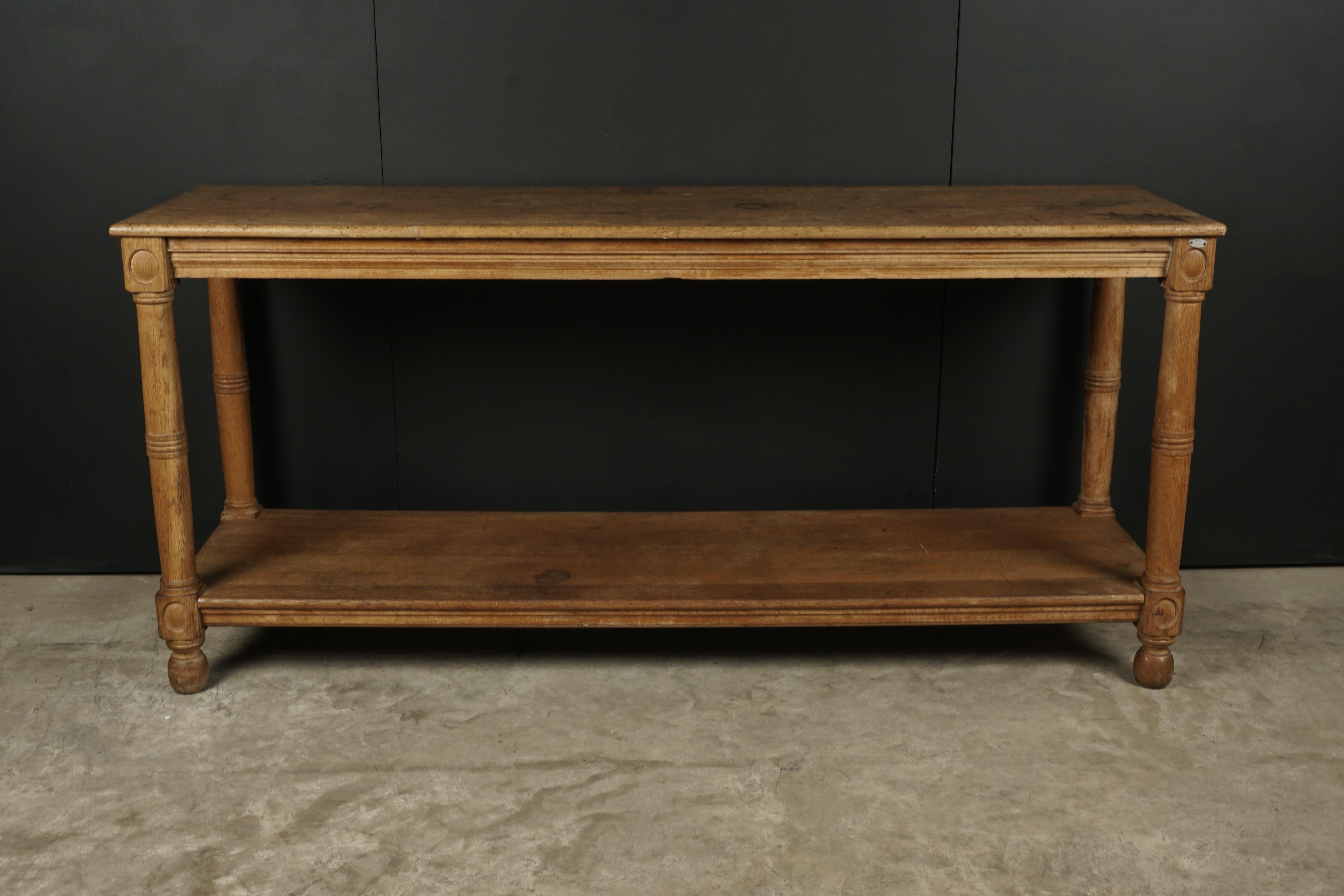 Early oak console table from France, circa 1930. Solid oak construction with very nice wear and patina.