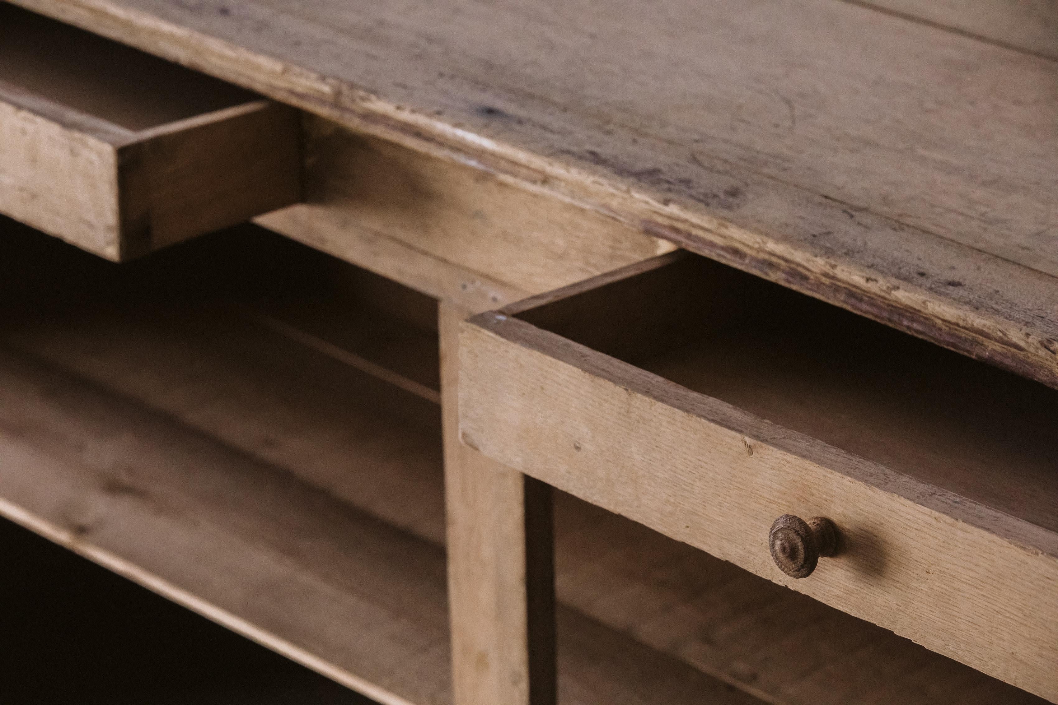 Early Oak Counter From France, circa 1900. Solid oak construction with great wear and patina. 

We prefer to speak directly with our clients. So, If you have any questions or would like to know more please give us a call or drop us a line. We