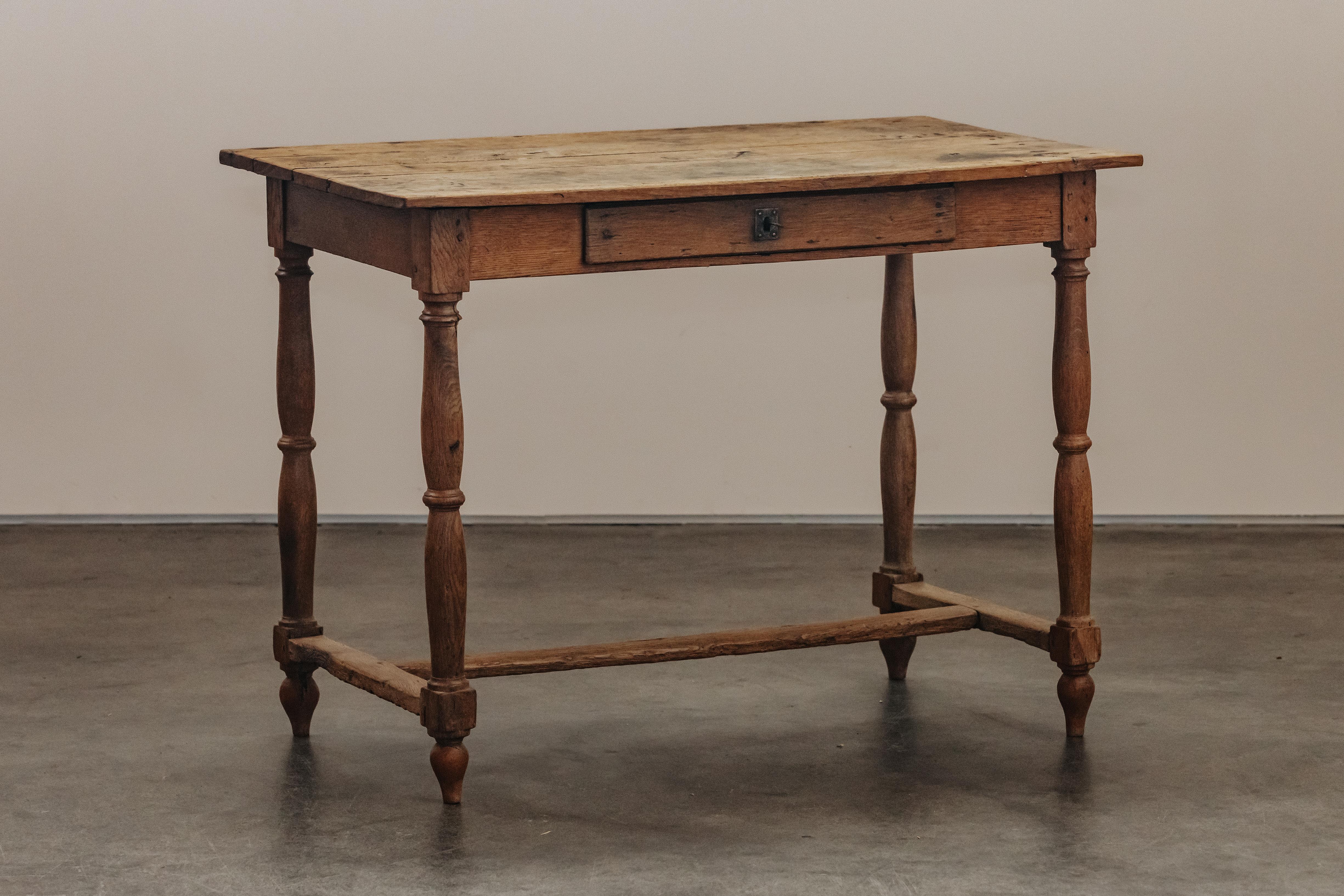 Early Oak Desk From France, Circa 1880.  Solid oak construction with original hardware and key.  Great patina and use.