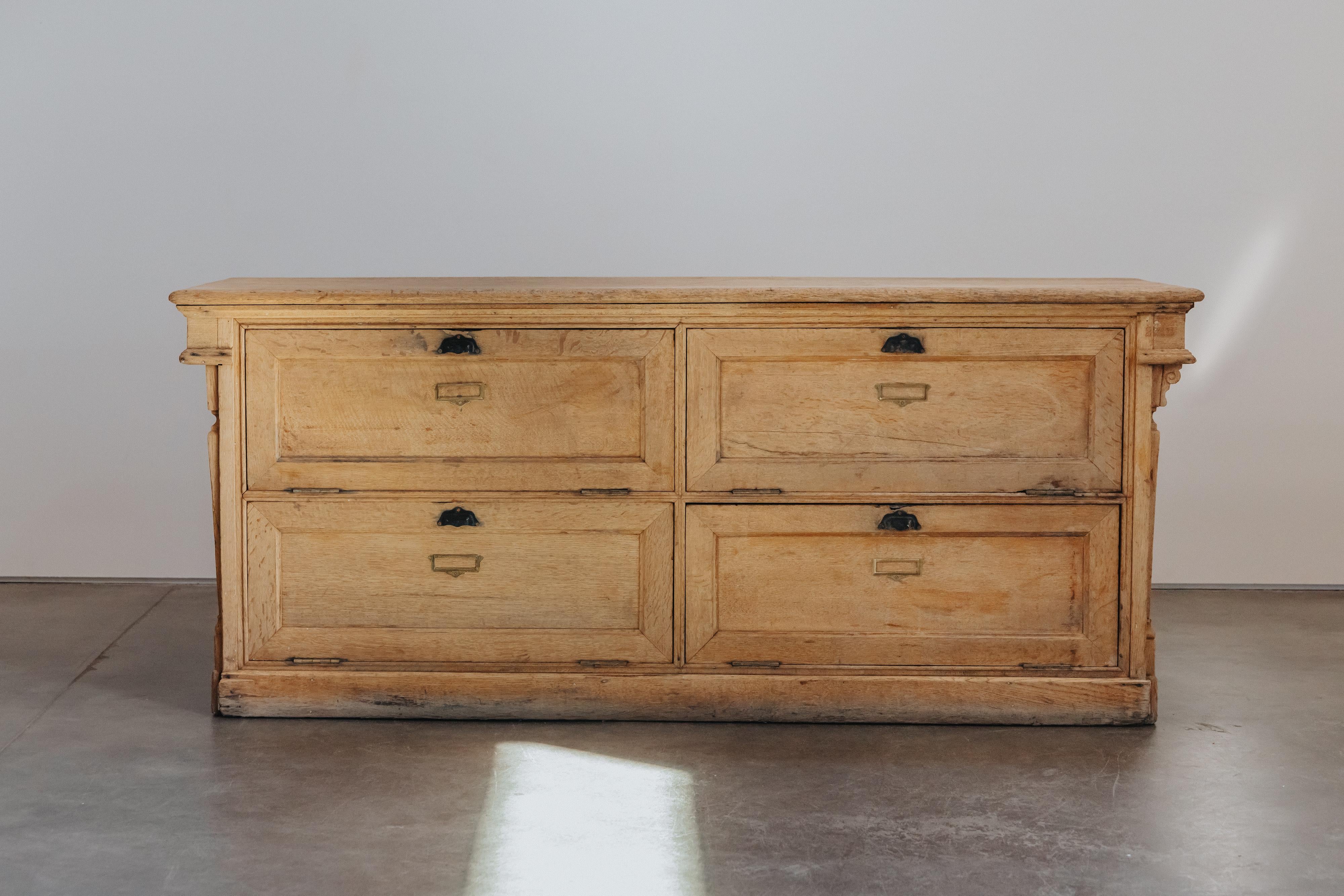 Early Oak Shop Counter From France, Circa 1920.  Solid oak construction with original hardware.  Great patina and use.