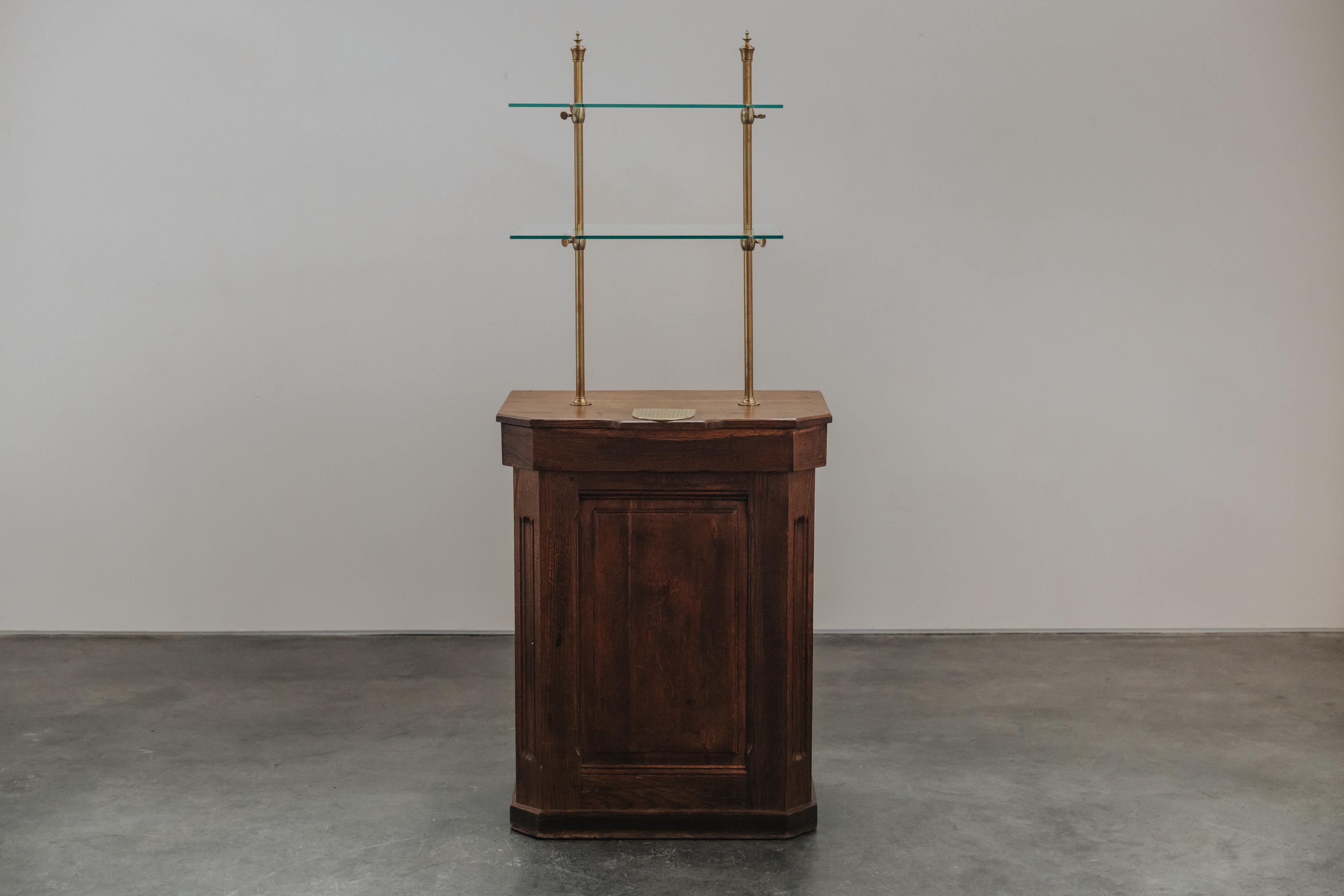 Early Oak Shop Display Cabinet From France, Circa 1920.  Solid oak construction with original glass shelves and brass hardware.  Excellent condition.