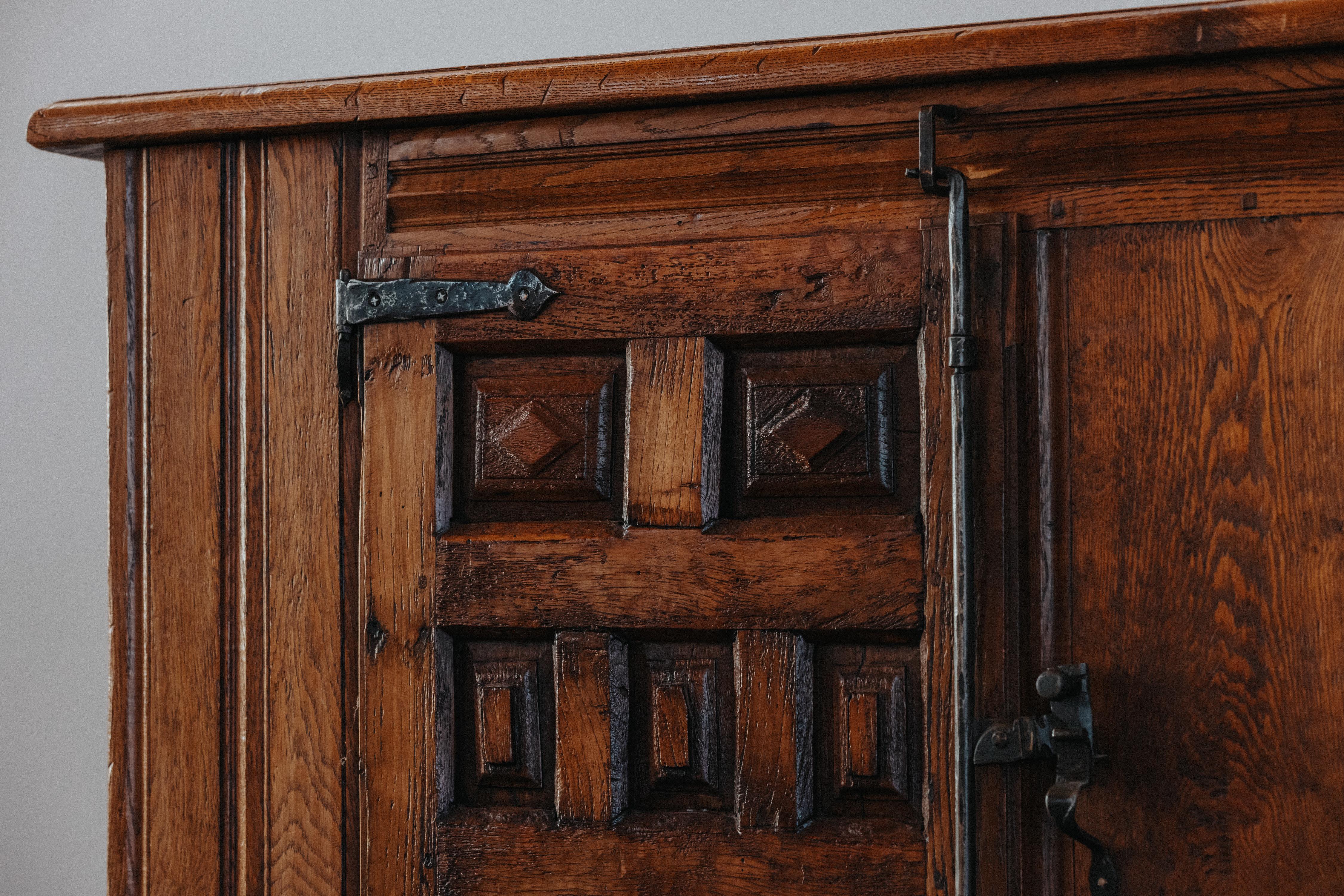 Early Oak Two Door Cabinet From Spain, Circa 1780.  Solid oak construction with original iron hardware and detail.  Superb patina and use.  Rare model.