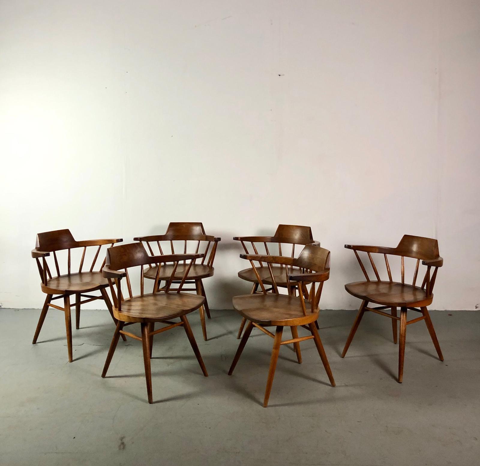 This set includes six early captain chairs and a one of a kind George Nakashima Plank dining table with two leaves. We have full documentation with drawings, conversations and invoice of George Nakashima.
We were able to source this rare set from