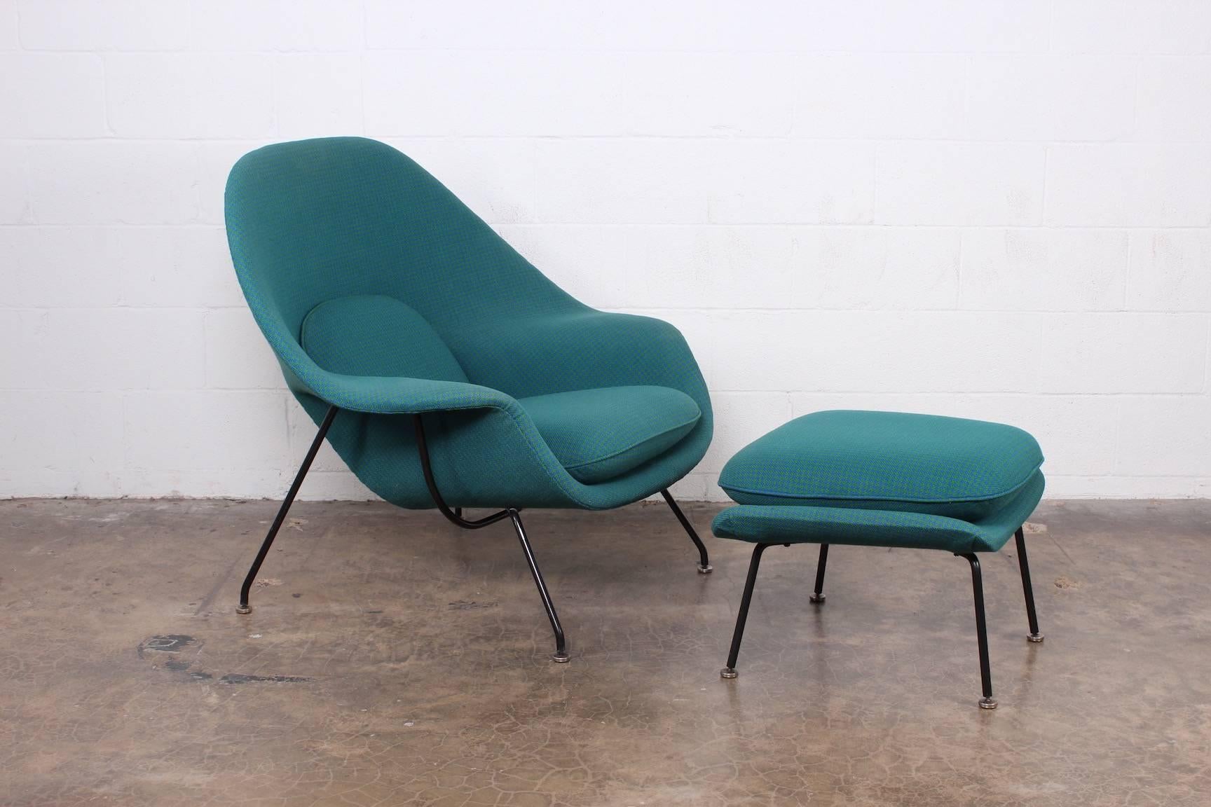 An early, all original Womb chair and ottoman designed by Eero Saarinen for Knoll.