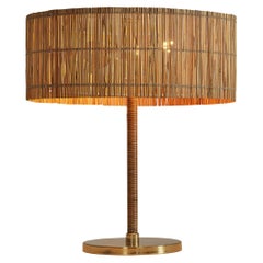 Early Paavo Tynell for Taito Oy Table Lamp in Brass and Cane