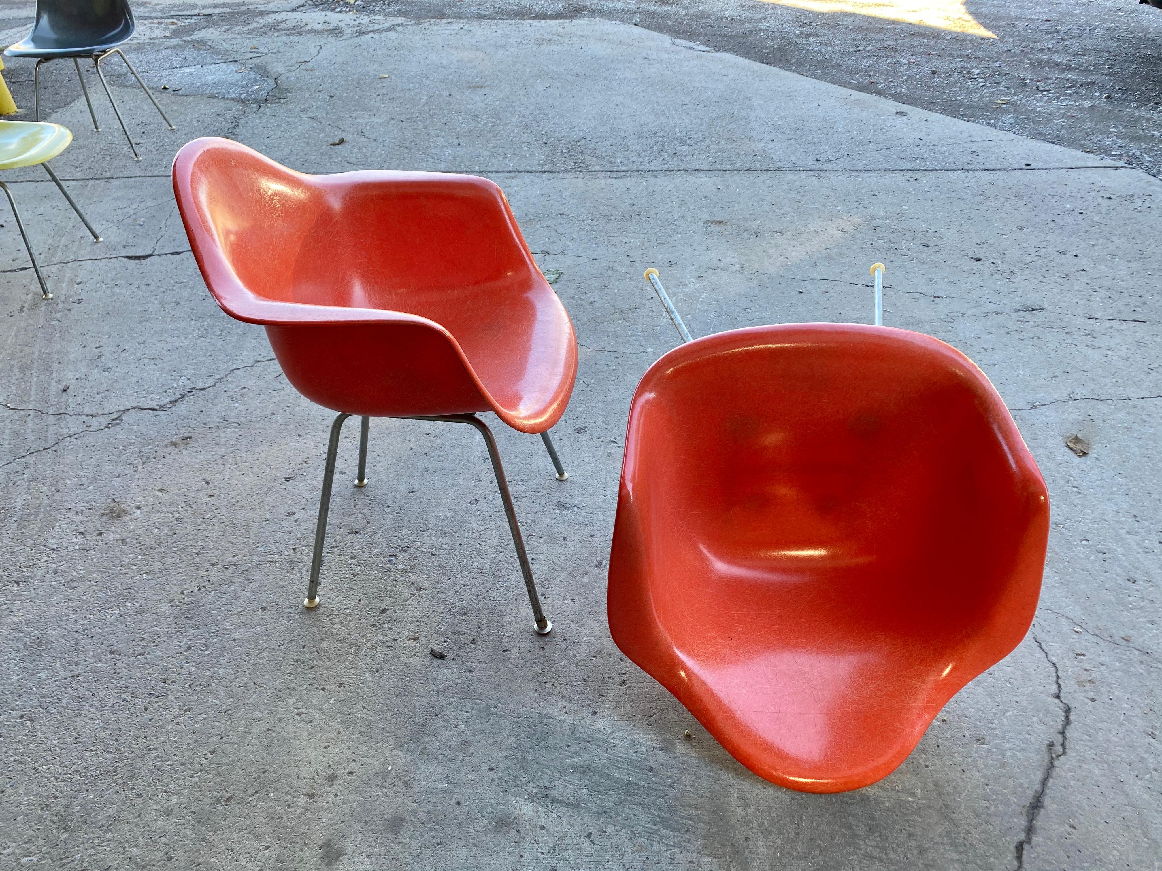 Metal Early Pair of Charles Eames Fiberglass Arm Shell Chairs 