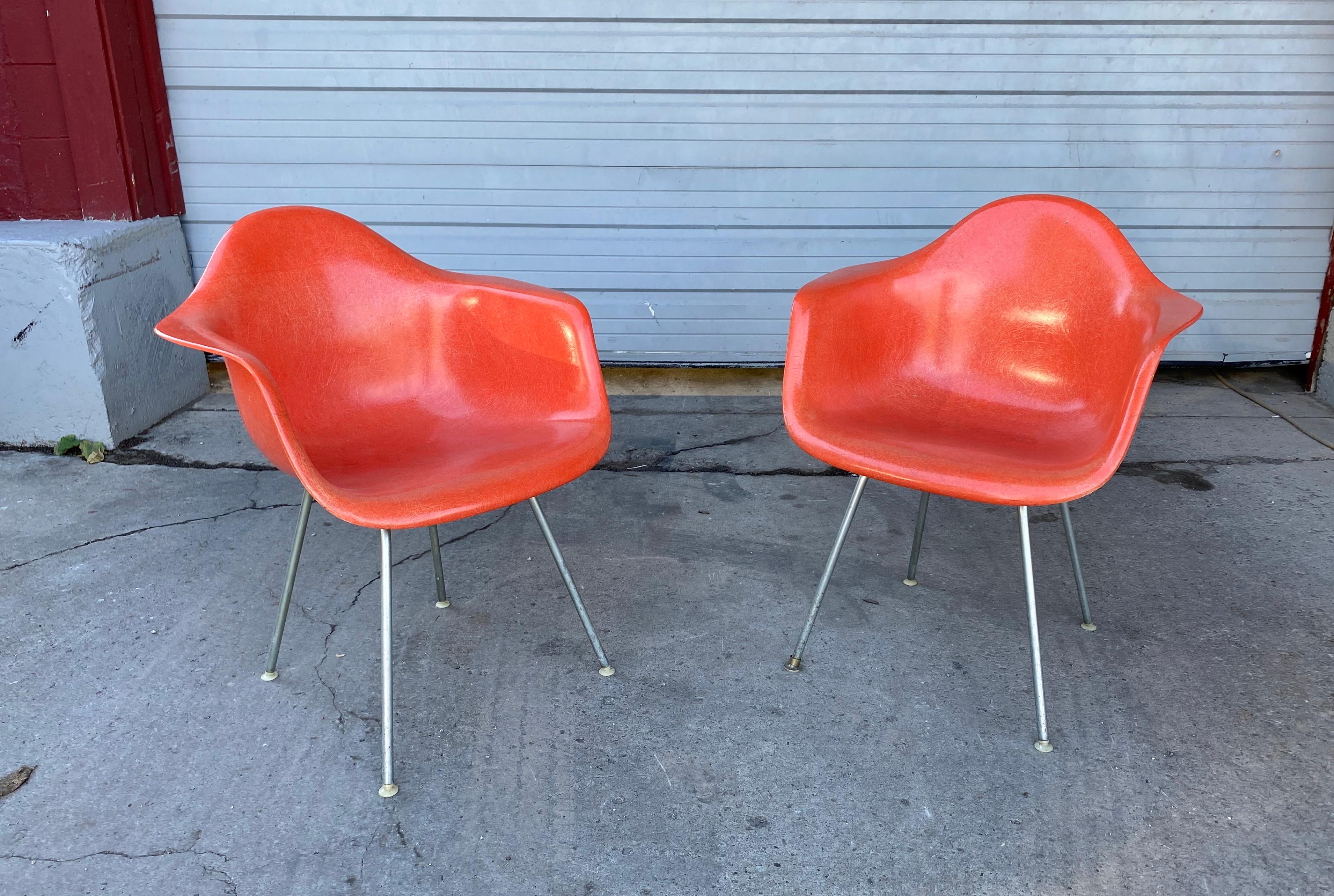 Early pair of Charles Eames fiberglass arm shell chairs 