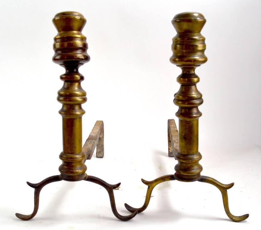 Nice early pair of American Chippendale andirons. Both show the expected wear, normal and consistent with age.