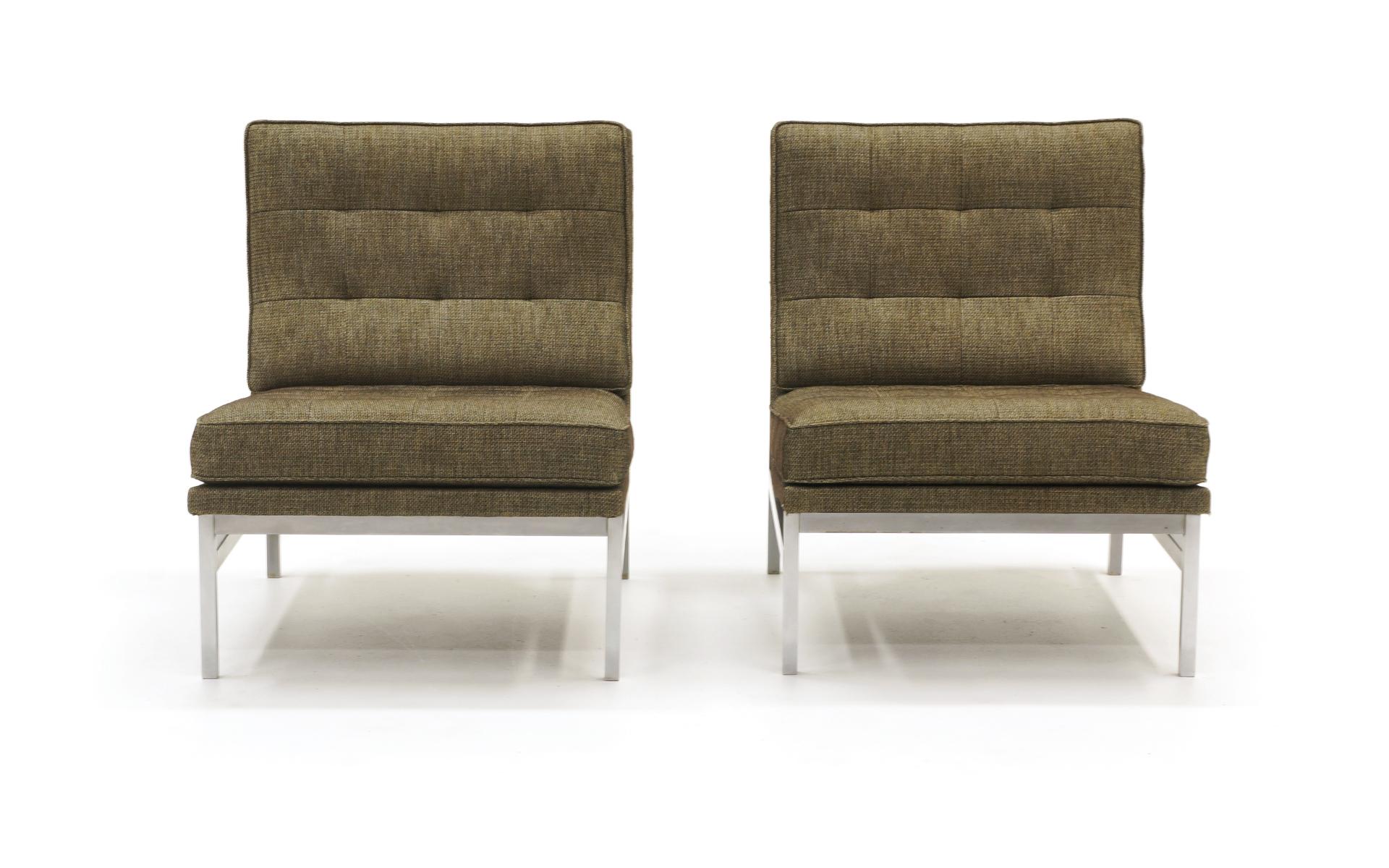 Early and rare pair of Florence Knoll chairs. Expertly reupholstered. These predate the parallel bar series with a simpler, cleaner, square tube brushed steel frame. Place them side by side to form a loveseat / settee.