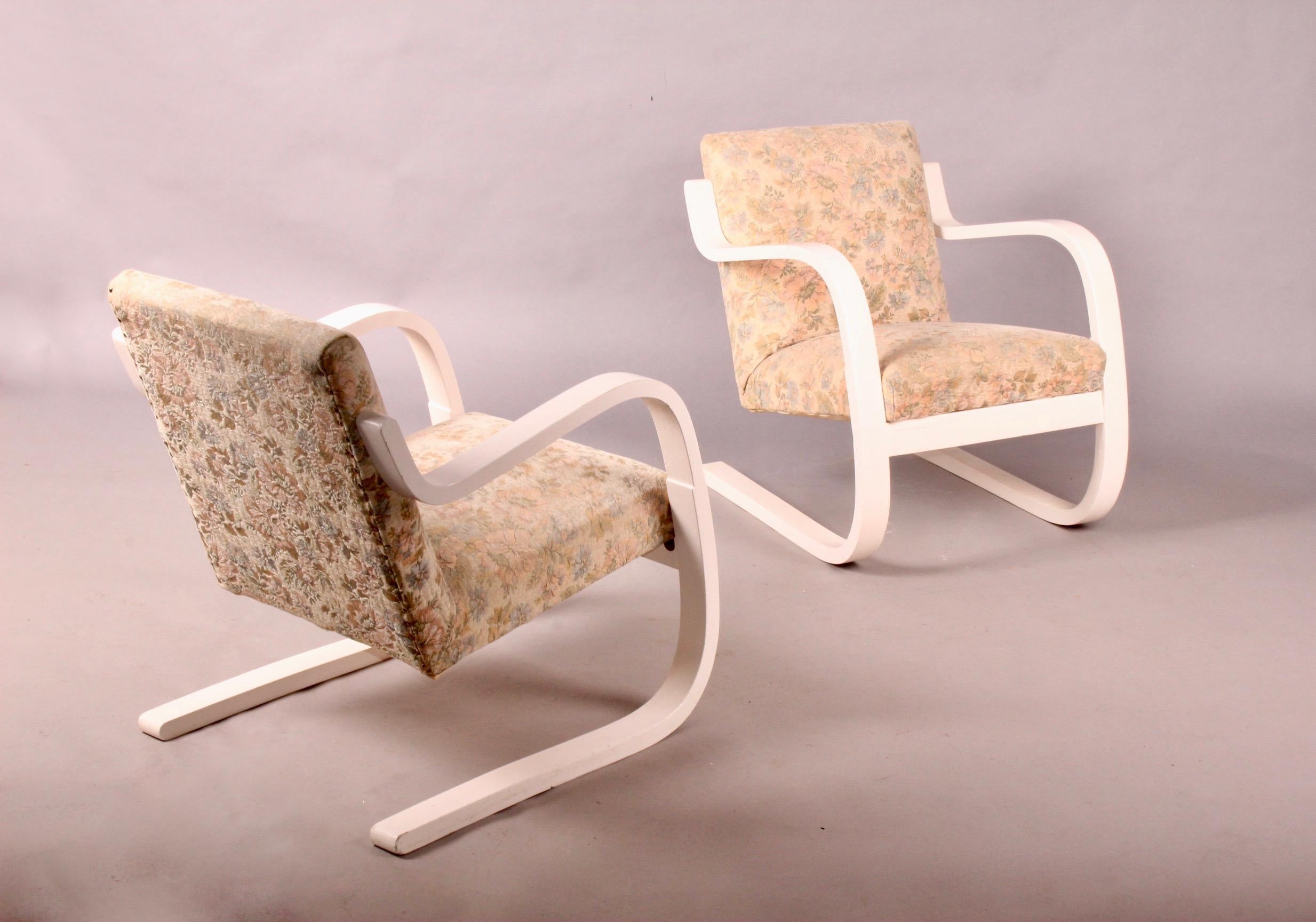 Early pair of Alvar Aalto model 402 chairs, probably repainted in white.