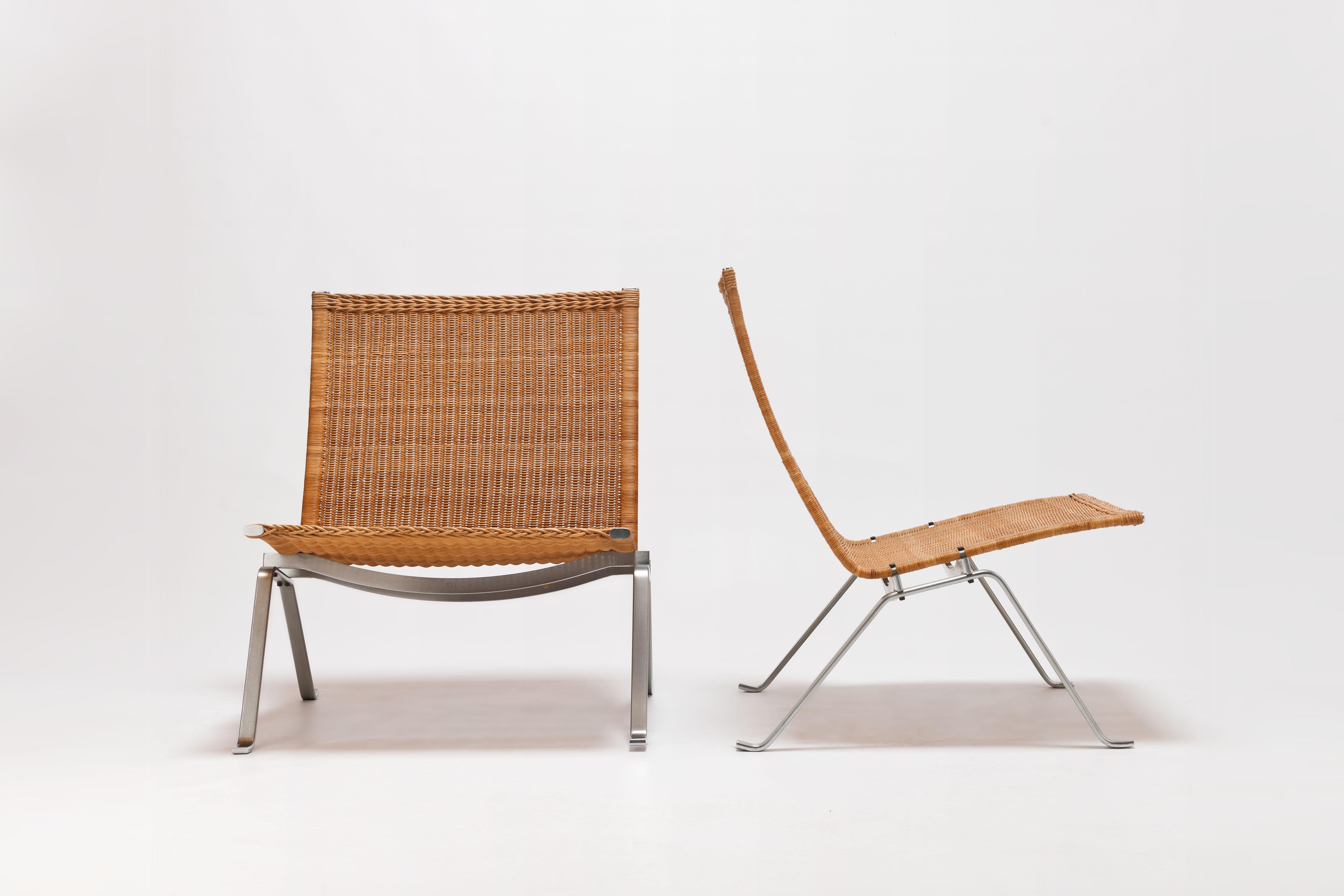 Beautiful original set of PK22 easy chairs in woven wicker with frames of matt chromed steel. Edition Ejvind Kold Christensen, marked with the EKC stamp to underside of seat (photographed).

The set was purchased in 1977, original (Dutch) purchase