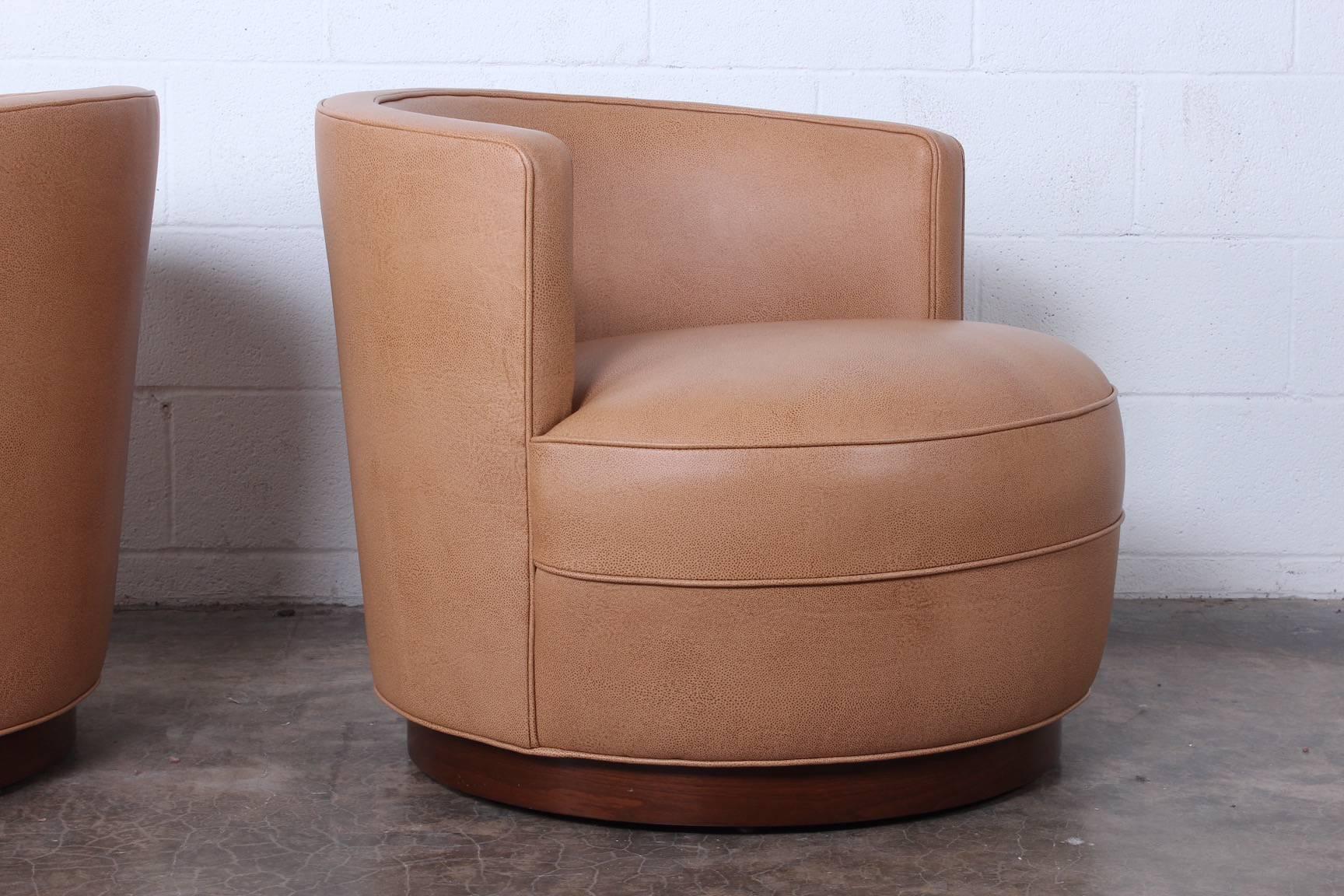 Leather Early Pair of Dunbar Swivel Chairs by Edward Wormley