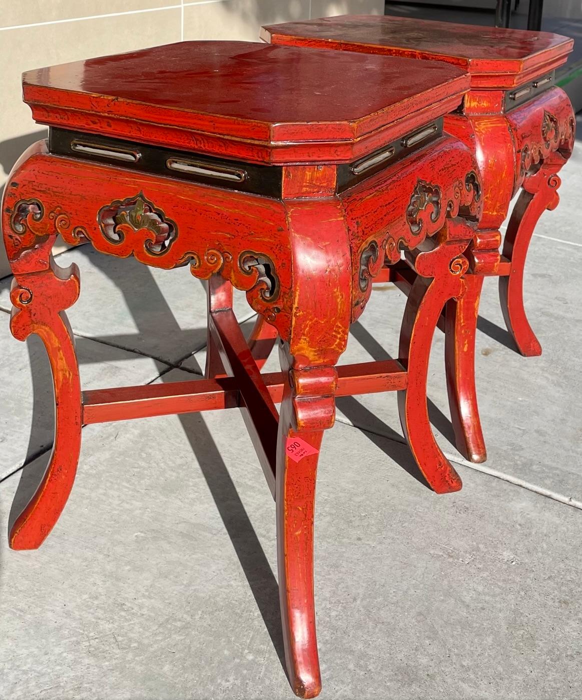 Exquisite pair of rare Fijian side tables. The color of these tables is very nearly a Diana Vreeland red and would certainly have looked right at home in one of her storied interiors.