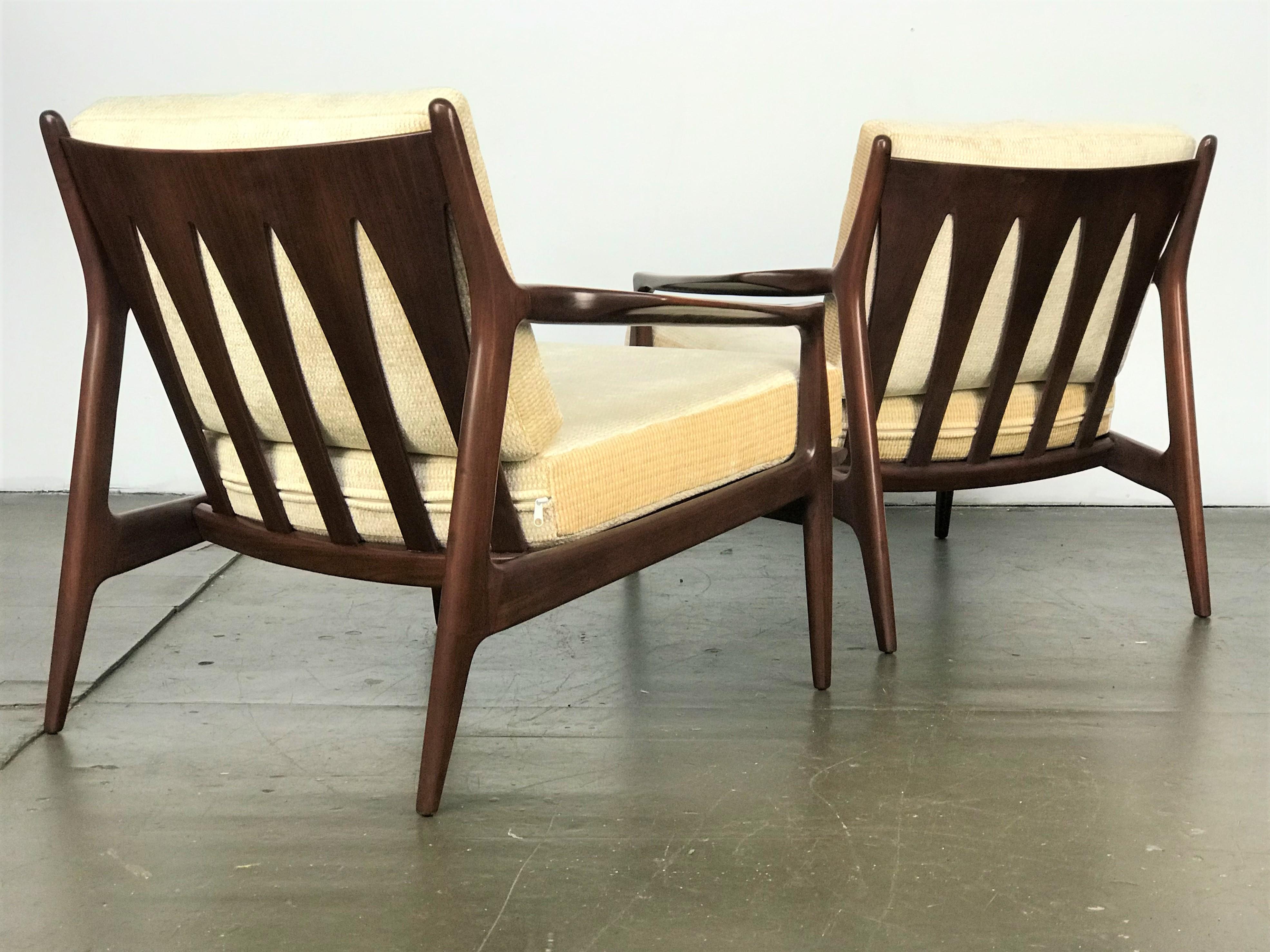 Scare and early pair of sculptural low back 'Archie' chairs designed by Milo Baughman for Thayer Coggin, circa 1965. Refinished walnut frames, with new cushions and upholstery. Both have early labels.
These excellent sculptural Cathedral-style-back