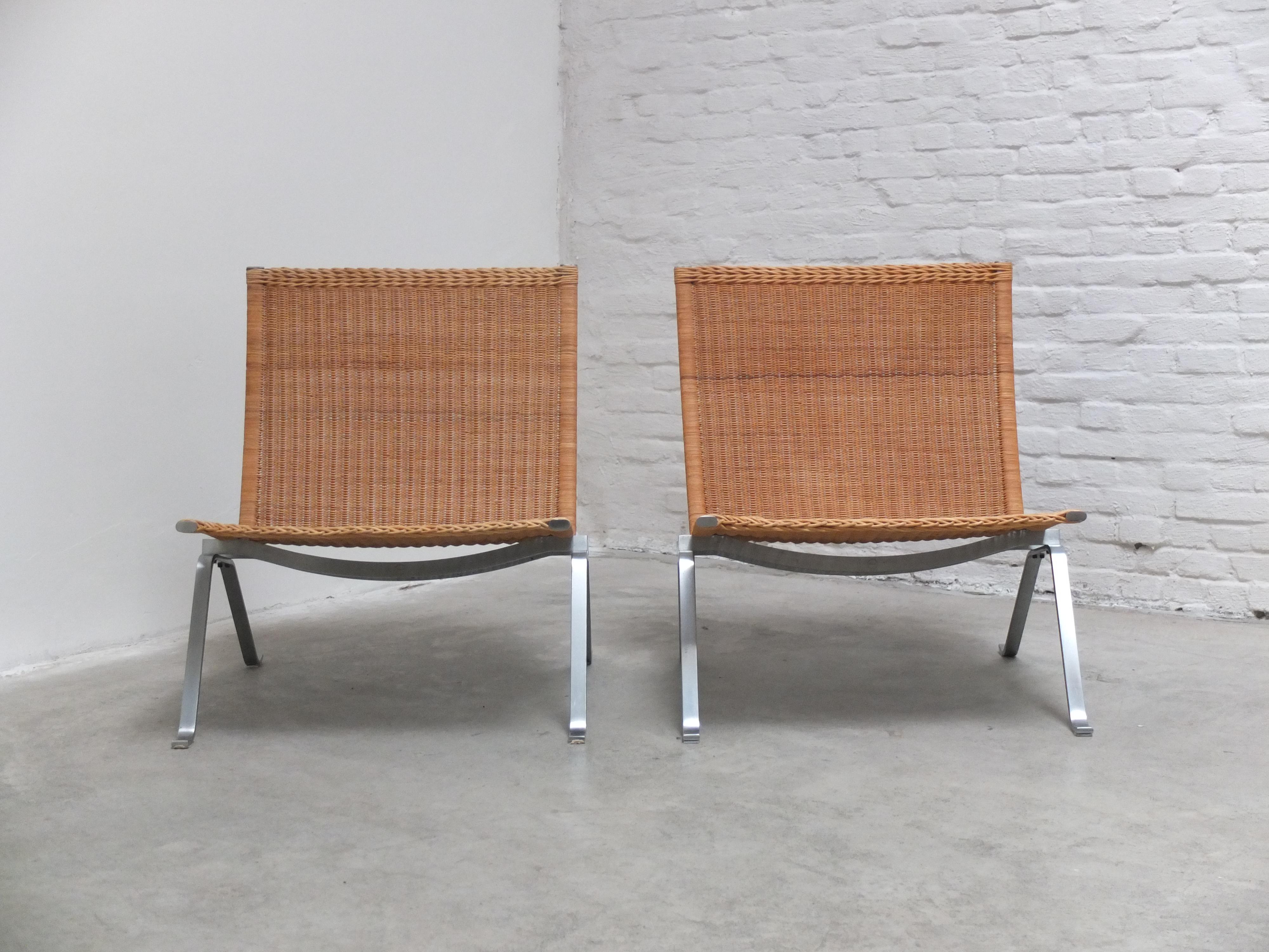 Fantastic pair of ‘PK22’ easy chairs in natural wicker designed by Poul Kjærholm in 1956. This pair comes with the original cane seats with a great patina thanks to age and use after almost 40 years. These chairs are among the first productions by