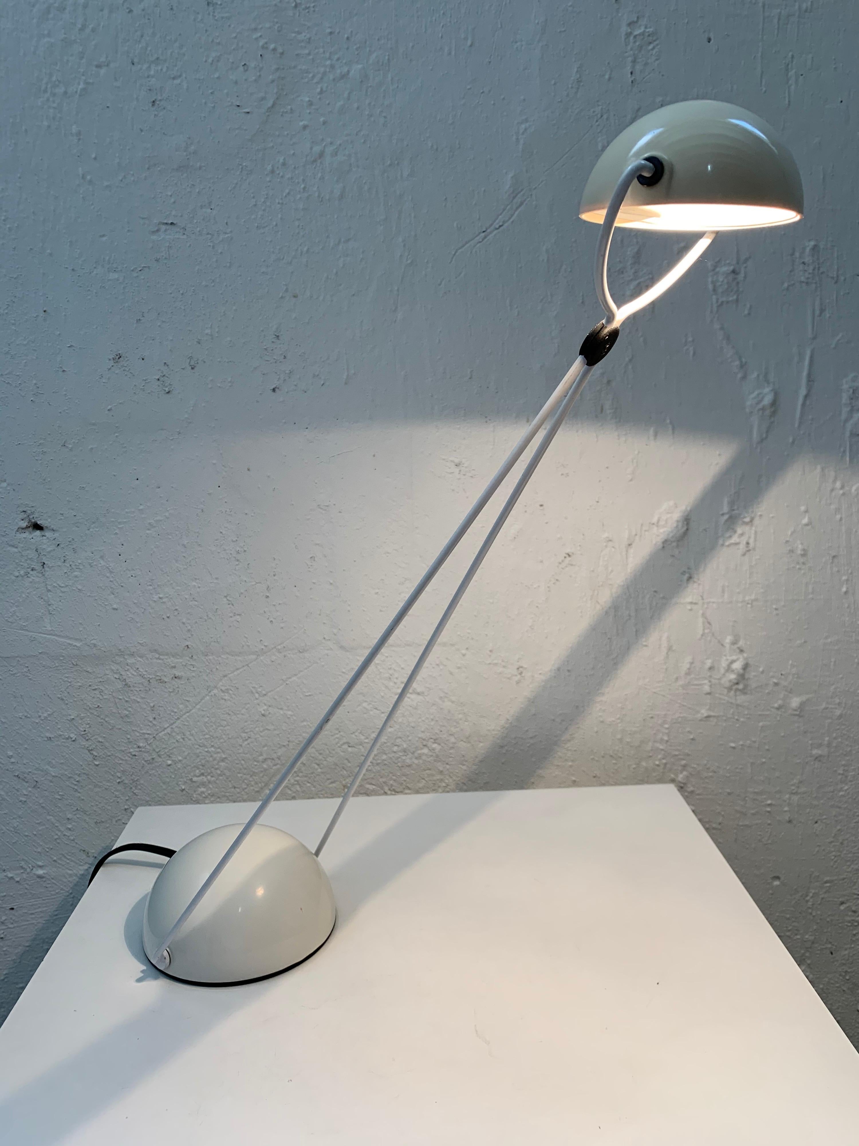 Original early edition Postmodern table desk or task lamp, articulating and adjustable design rendered in creamy off-white plastic and painted steel, designed by Paolo Piva for Stefao Cevoli, Italy, 1980s.