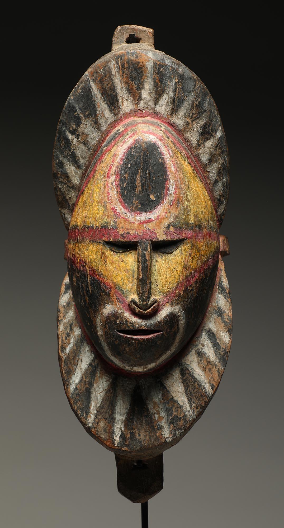 Tribal Early Papua New Guinea Sepik Wood Yam Mask Yellow Red and Black on Custom Base For Sale