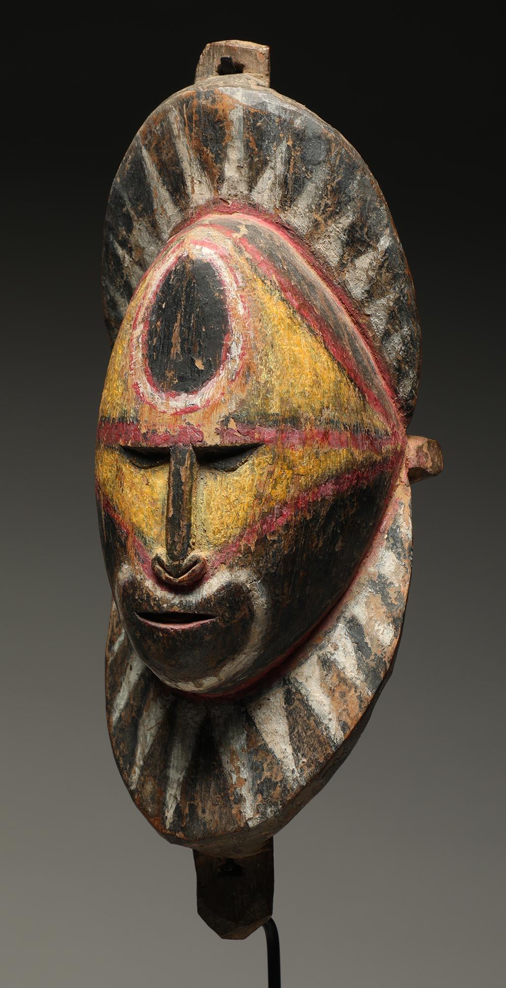 Papua New Guinean Early Papua New Guinea Sepik Wood Yam Mask Yellow Red and Black on Custom Base For Sale