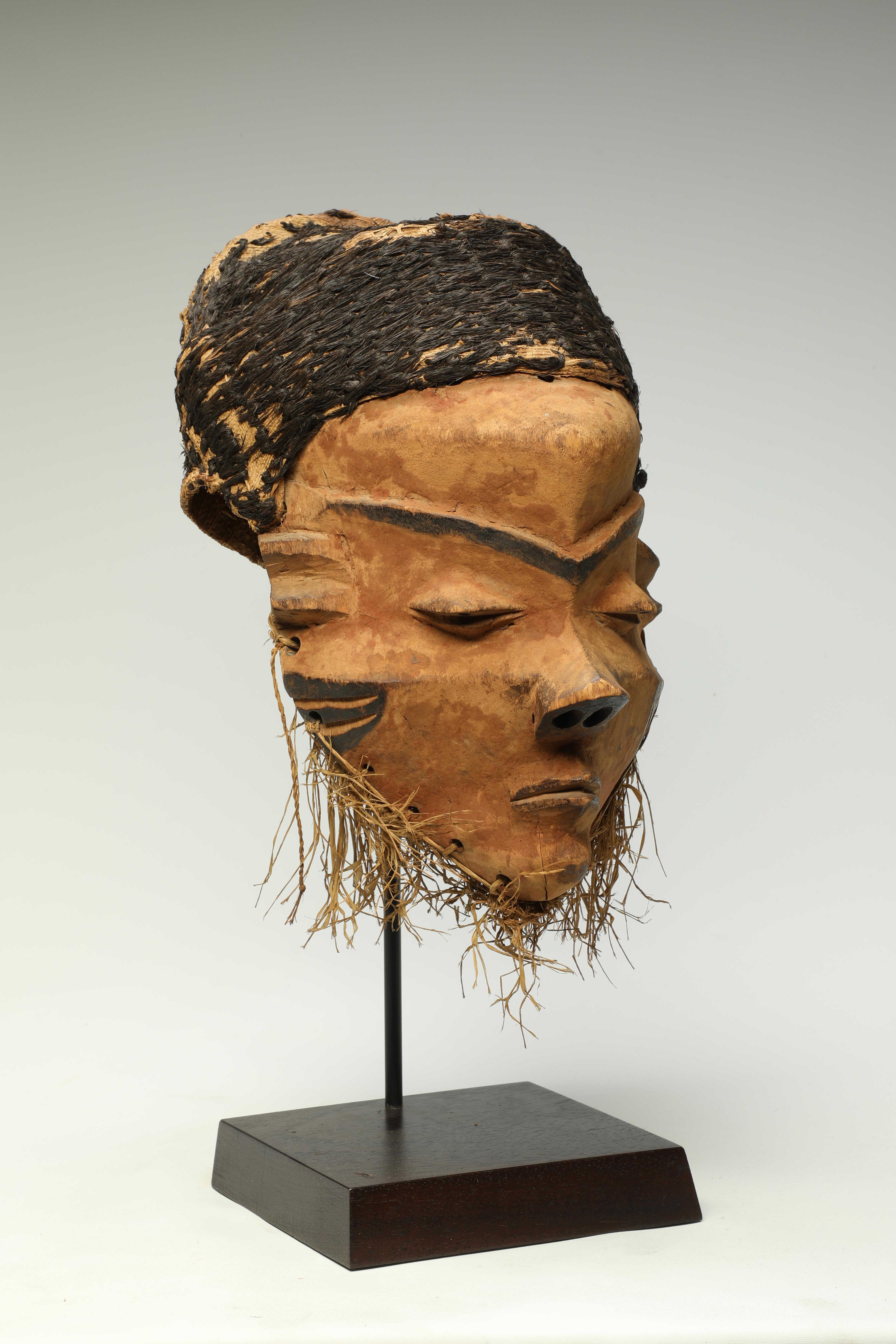 Hand-Crafted Early Pende Giwoyo Mask with Strong Face and Woven Black Raffia Hair Cap  For Sale