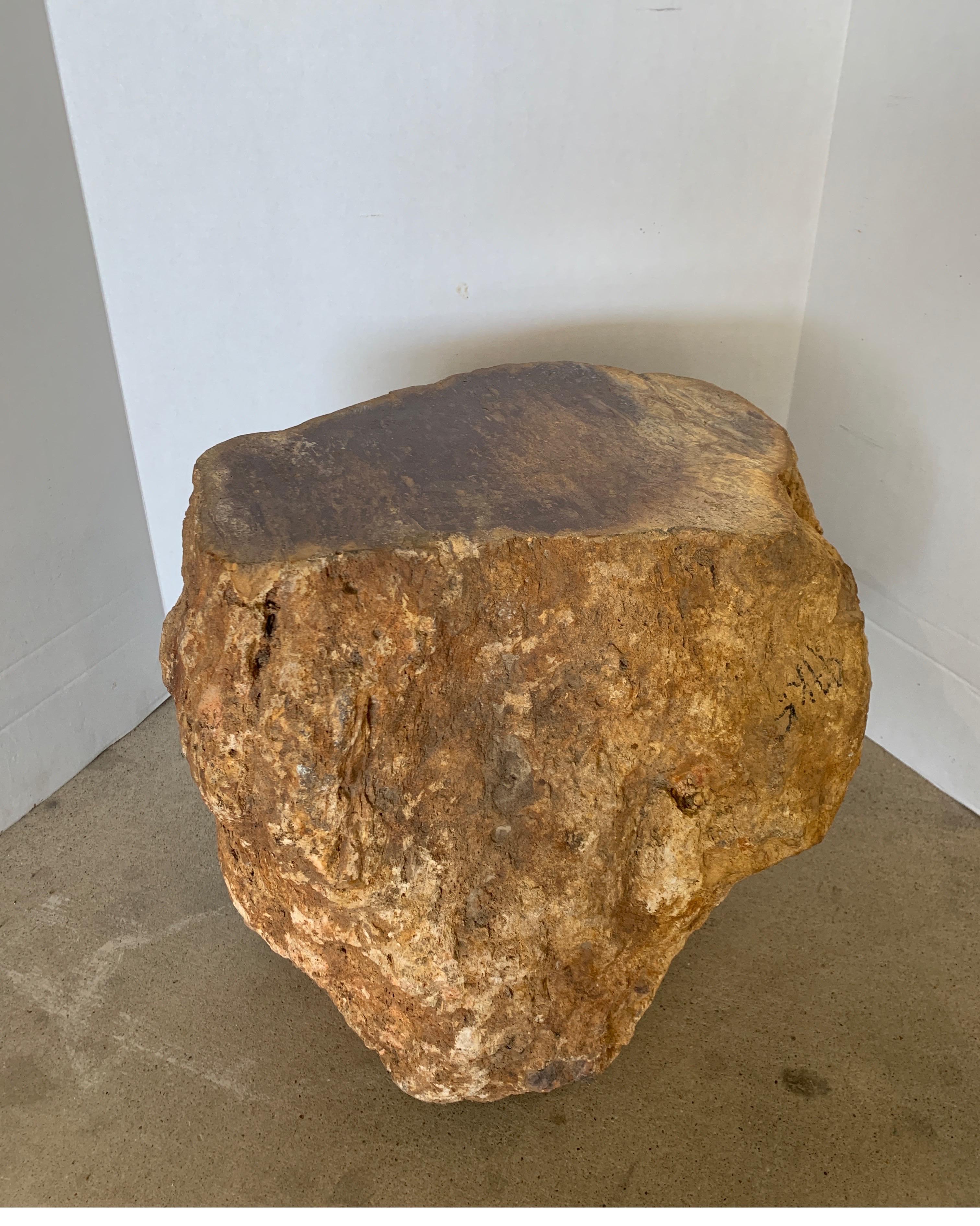 This is a wonderful petrified wood that is the perfect side table next to a chair.
It originates from Madagascar.
Measures: 17.38 W x 13 D x 15.75 T.