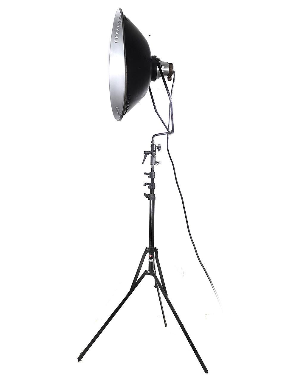 I think this is one of the nicest looking professional studio lights. The shallow aluminum reflector has an impressive 22 inch diameter. It has been rewired to with an E26 standard bulb socket. In addition there is a disc bulb cover that cuts bulb