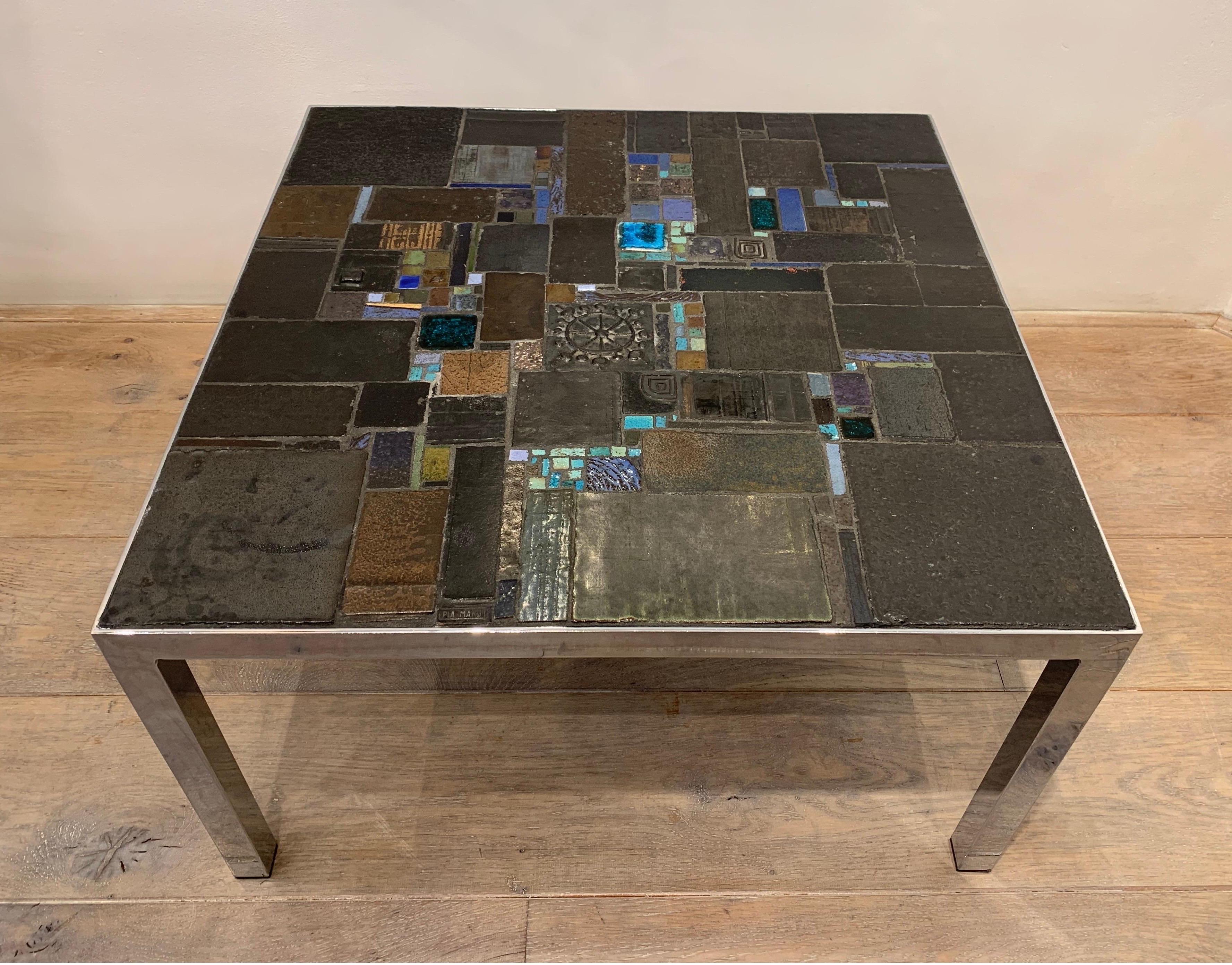 The table is an early creation by the Belgian designer Pia Manu. He is famous for creating ceramic table with ceramics by the Belgian workshop Amphora, which under was ruled under its founder Rogier Vandeweghe. The artistic quality and the quality