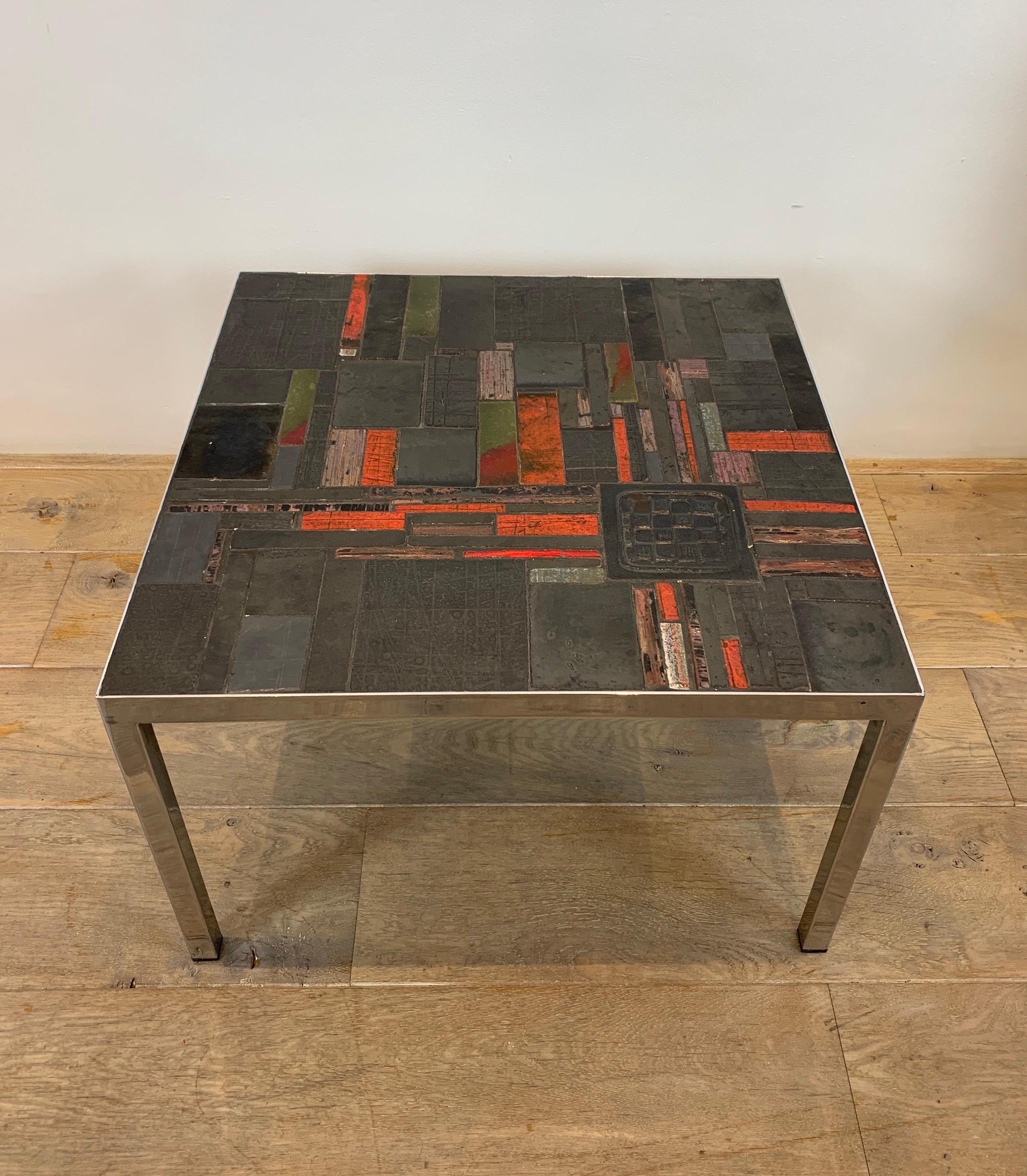 Pia Manu is famous Belgian Ceramist active from the fifties. He designed ceramic table with ceramics from the Belgian workshop Amphora. The design of the table represents an abstract patchwork of ceramic pieces.