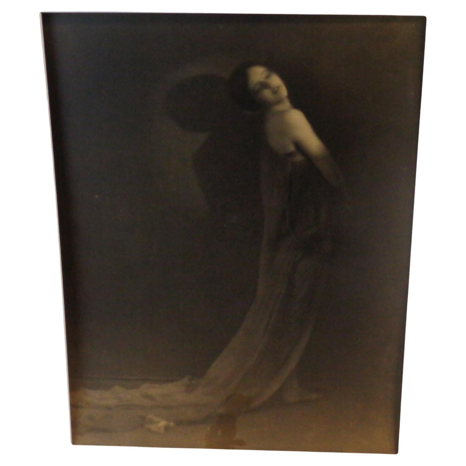 Early original pictorialist sepia tone gelatin silver print photograph of a sultry young woman in a flowing gown by Rochester NY photographer Ned Hungerford, 1900-1910. Beautiful ethereal imagery. Mat size 20