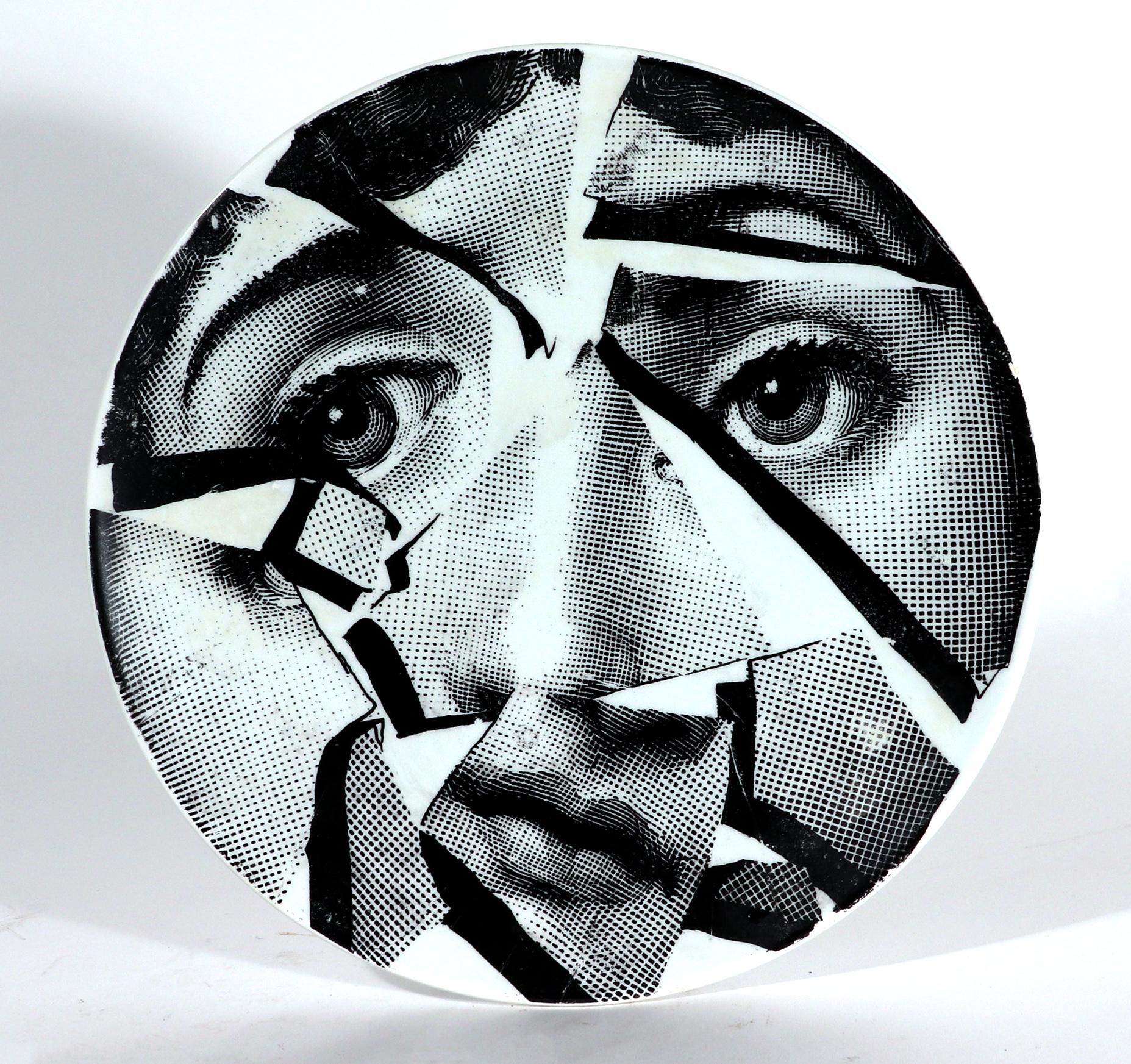 Piero Fornasetti Pottery Surrealist Themes & Variation plate, Shattered Face,
Circa 1952

This is a rare very early example of the Fornasetti Themes & Variation pattern on a pottery body. It is so early that it does not have the pattern number on