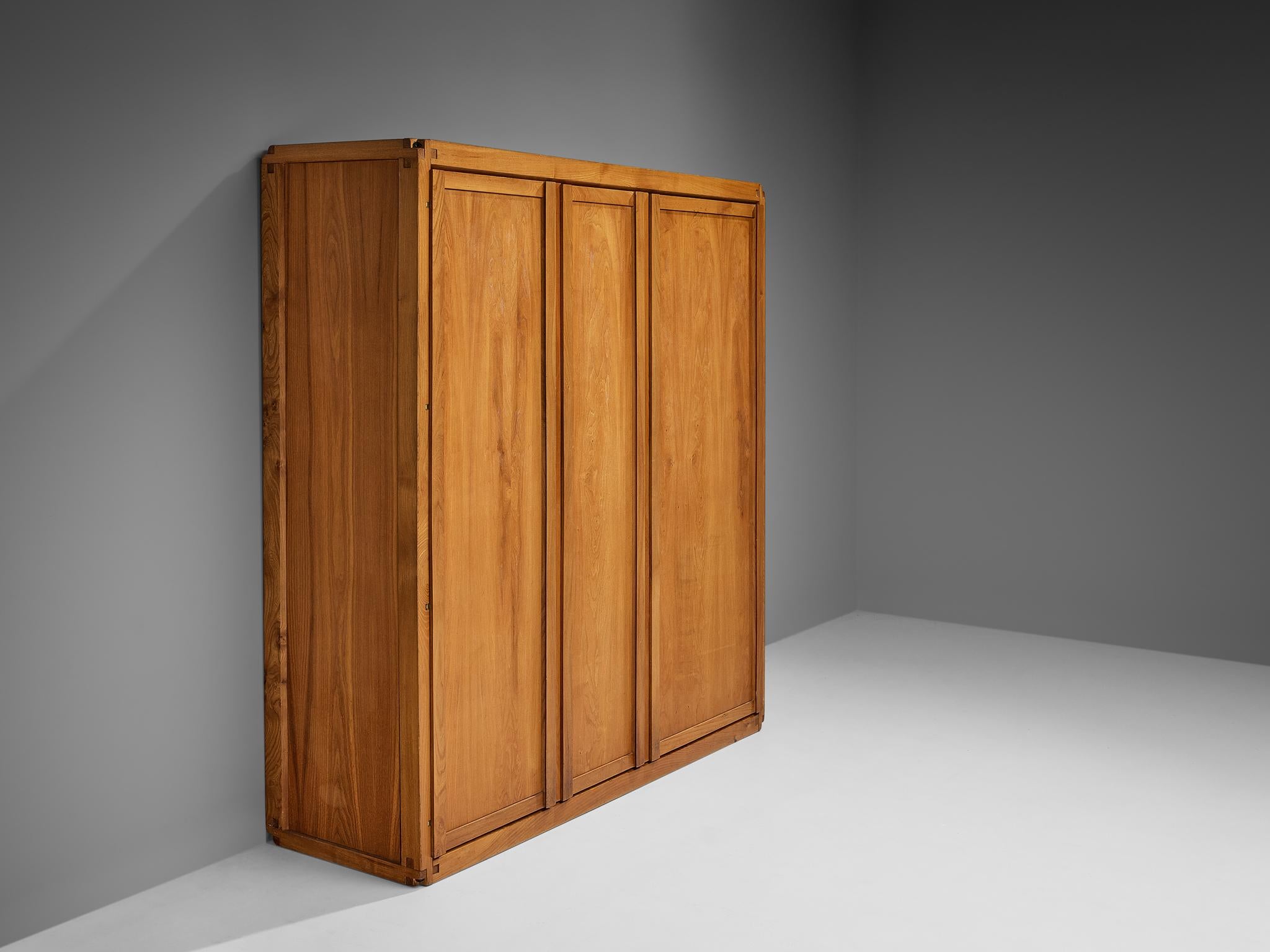 Pierre Chapo, wardrobe, model 'B10', elm, brass, France, 1960s

This armoire by Pierre Chapo has a splendid construction that epitomizes a simplistic, natural and timeless aesthetic. The front convinces with its clear and sheer appearance with