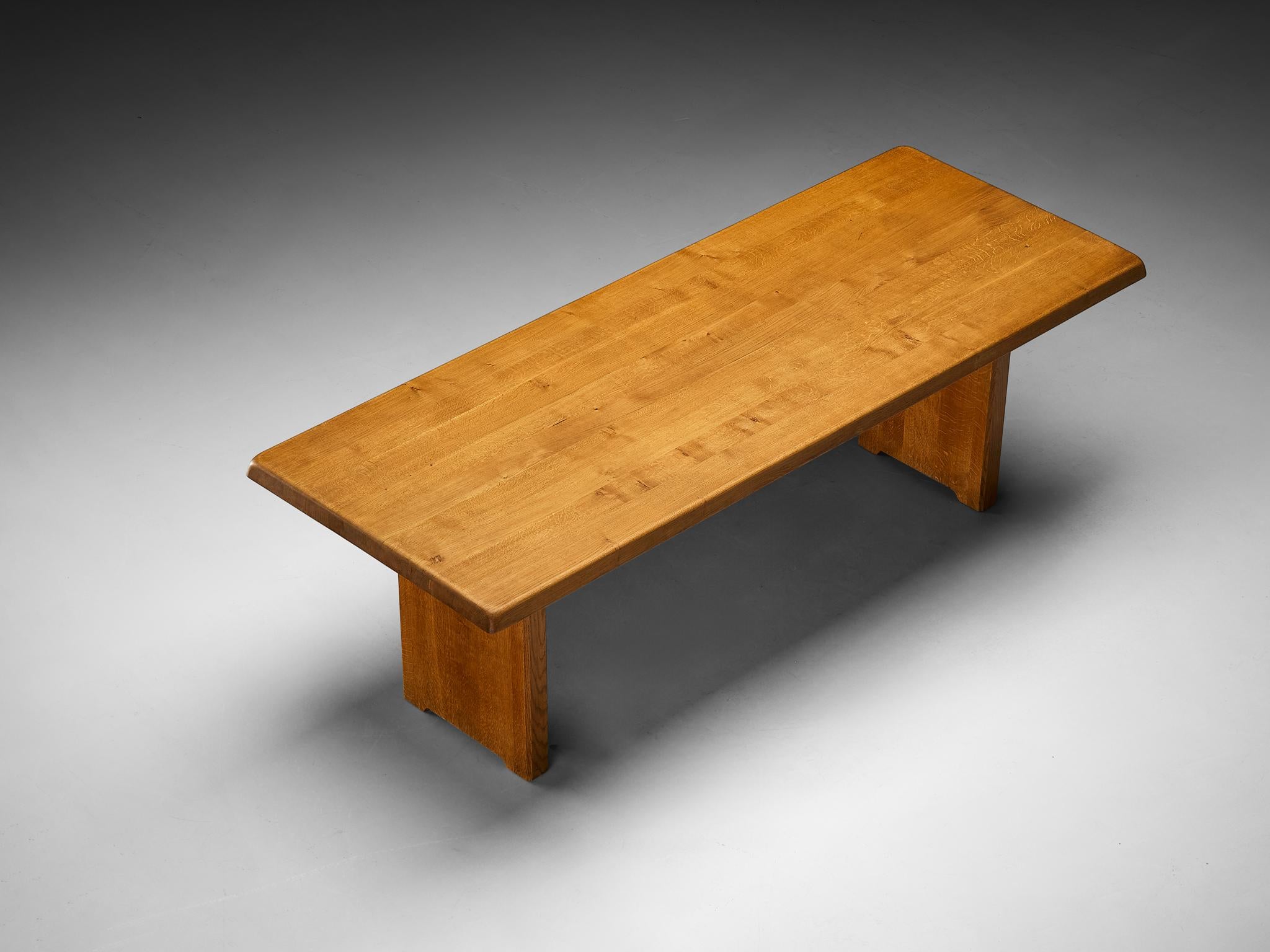 Pierre Chapo, dining table, model 'T14D', solid oak, France, circa 1978

This dining table is an early edition designed by French designer Pierre Chapo. It features a rectangular top with gently sloping edges, supported by a two-legged base. The