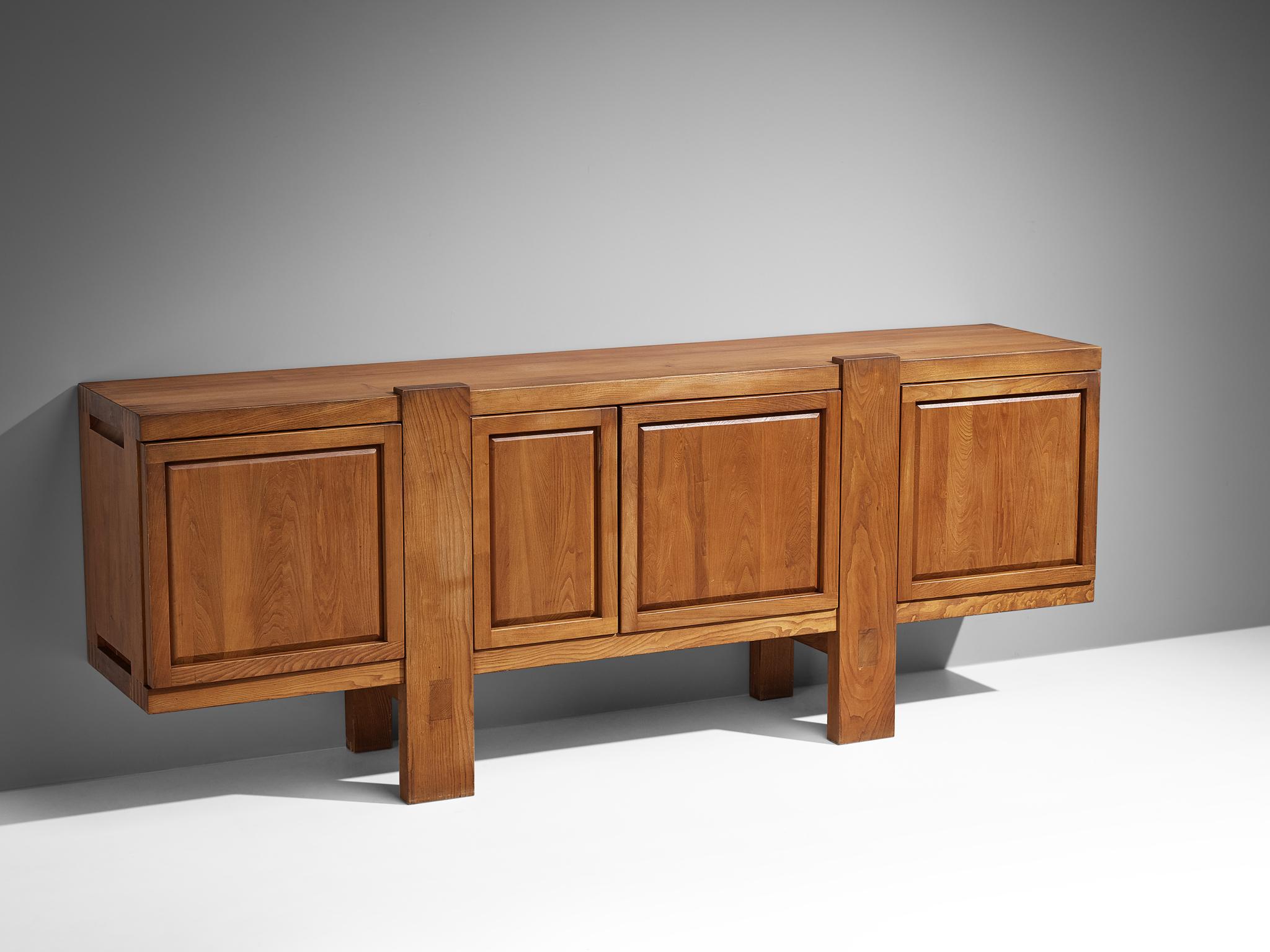 Pierre Chapo, sideboard model 'R16', elm, France, design 1966

This piece is one of the early editions designed by Pierre Chapo, known for his hallmark use of solid elmwood and a commitment to pure and clean design and construction principles. This