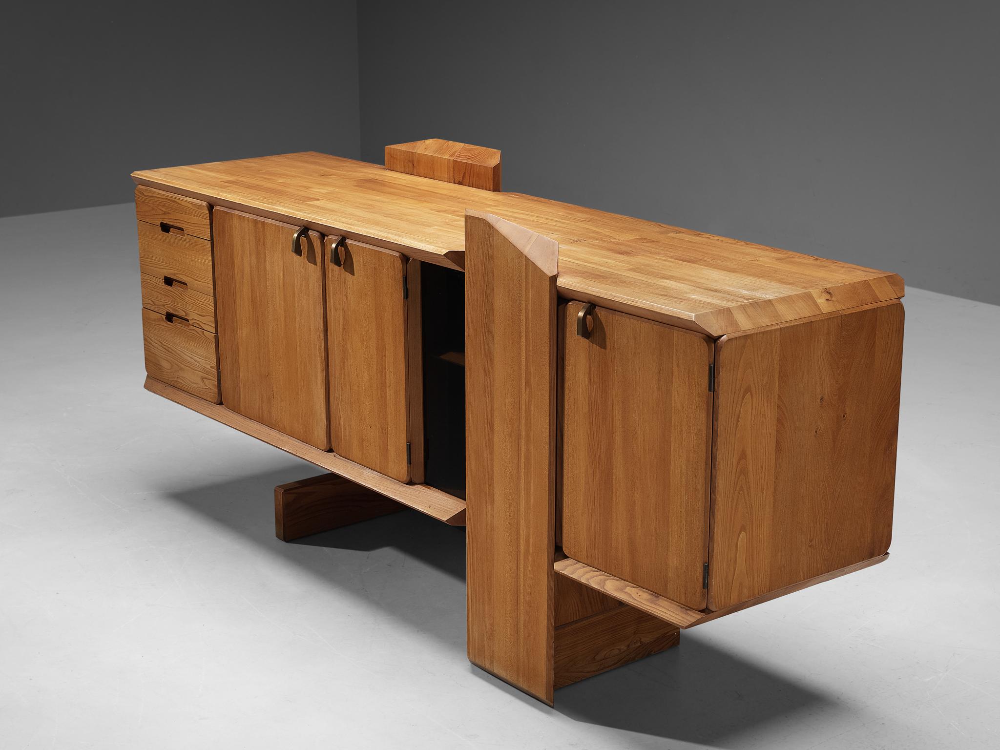 Pierre Chapo, sideboard, model 'R28', elm, France, 1985.

This table is one of the early editions designed by Pierre Chapo, known for his hallmark use of solid elmwood and a commitment to pure and clean design and construction principles. The R28