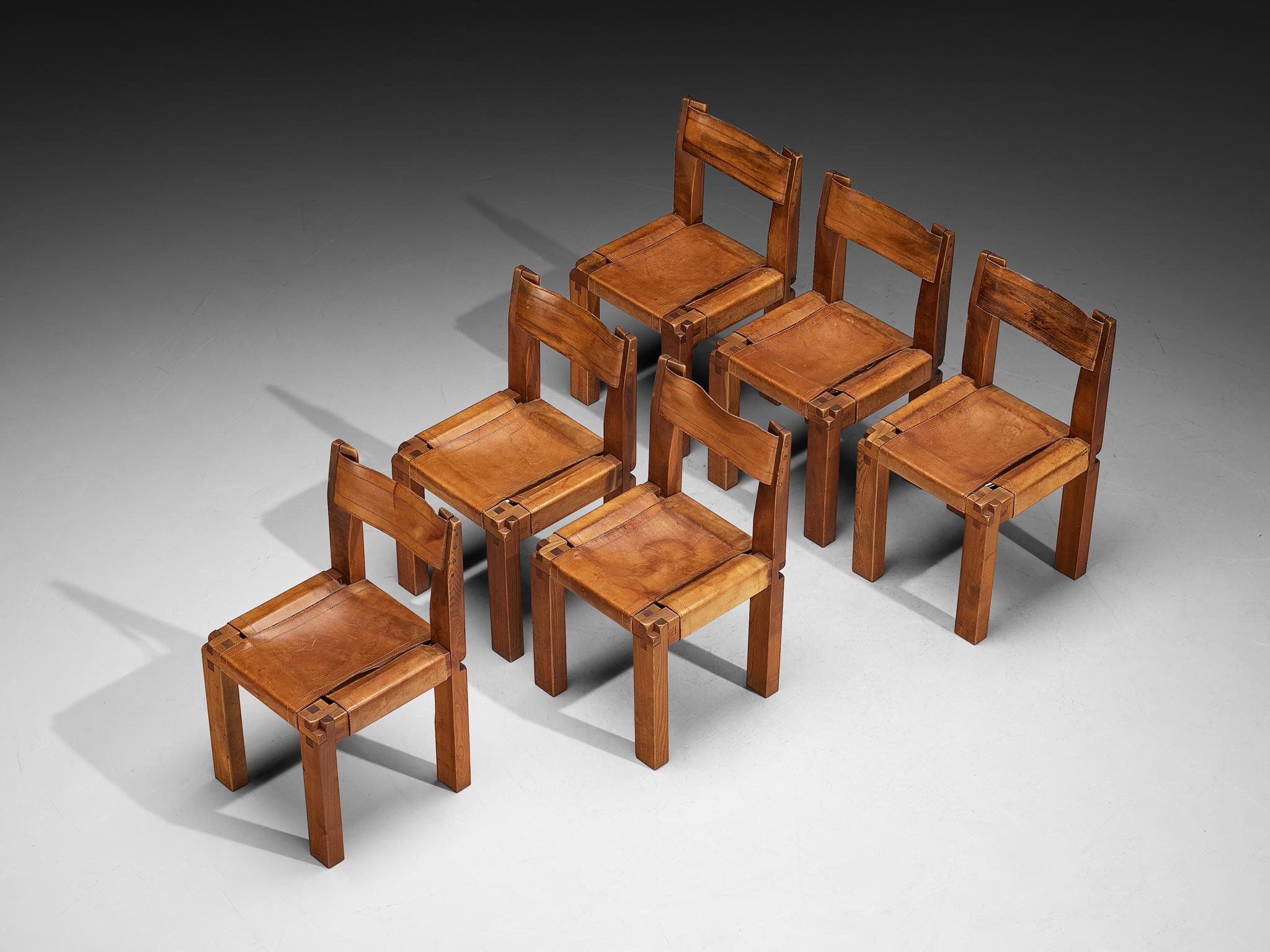 Pierre Chapo, set of six dining chairs, model 'S11', elm, leather, rope, brass, France, 1978

This design is an early edition by Pierre Chapo. Crafted from solid elmwood, the chairs exhibit a refined cubic design that is both sleek and contemporary