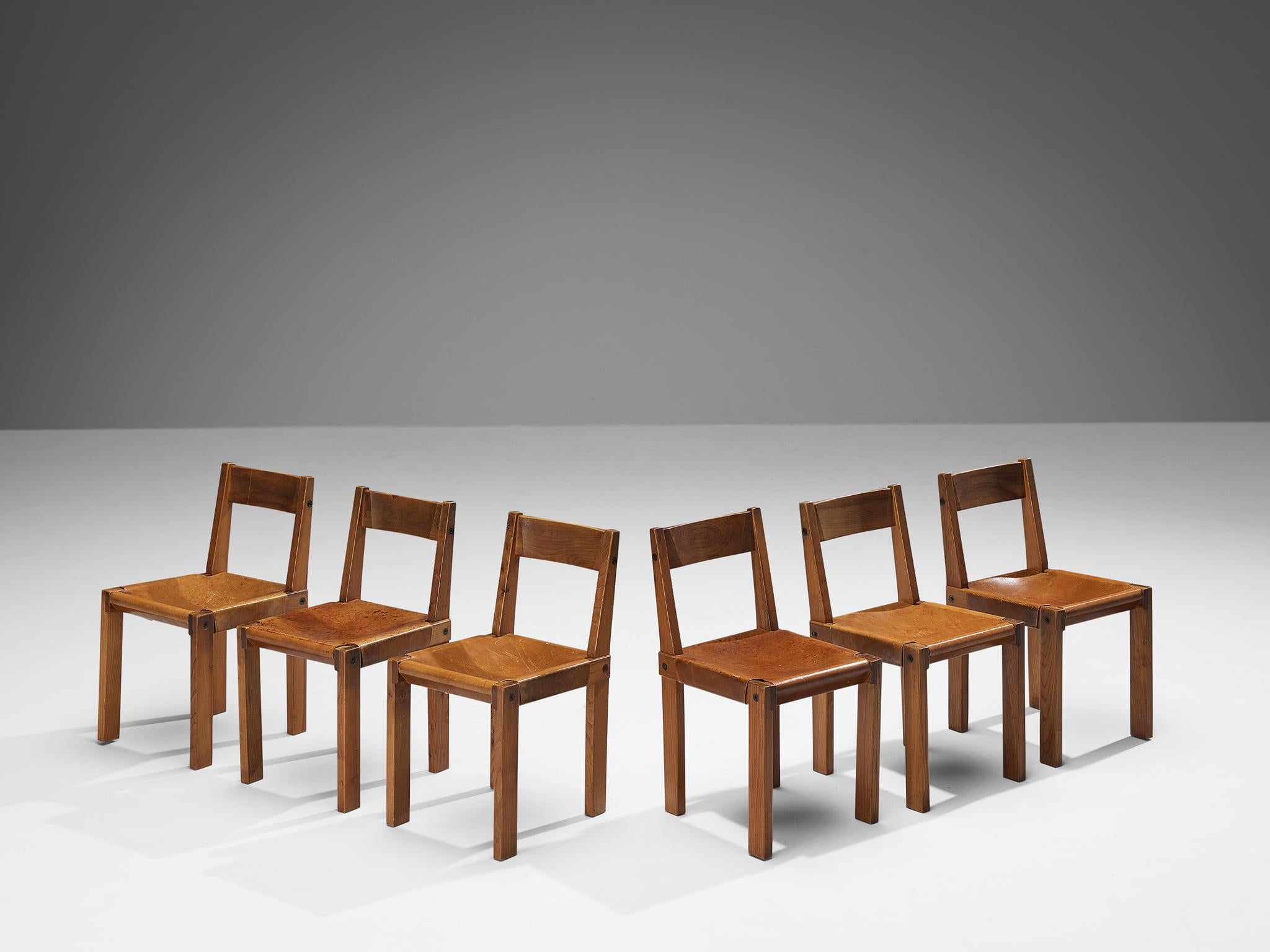 Pierre Corde, ensemble de six chaises de salle à manger, modèle 'S24', orme, cuir, corde, France, 1967.

Ces chaises sont les premières éditions conçues par Pierre Chapo, connu pour son utilisation caractéristique du bois d'orme massif et pour son