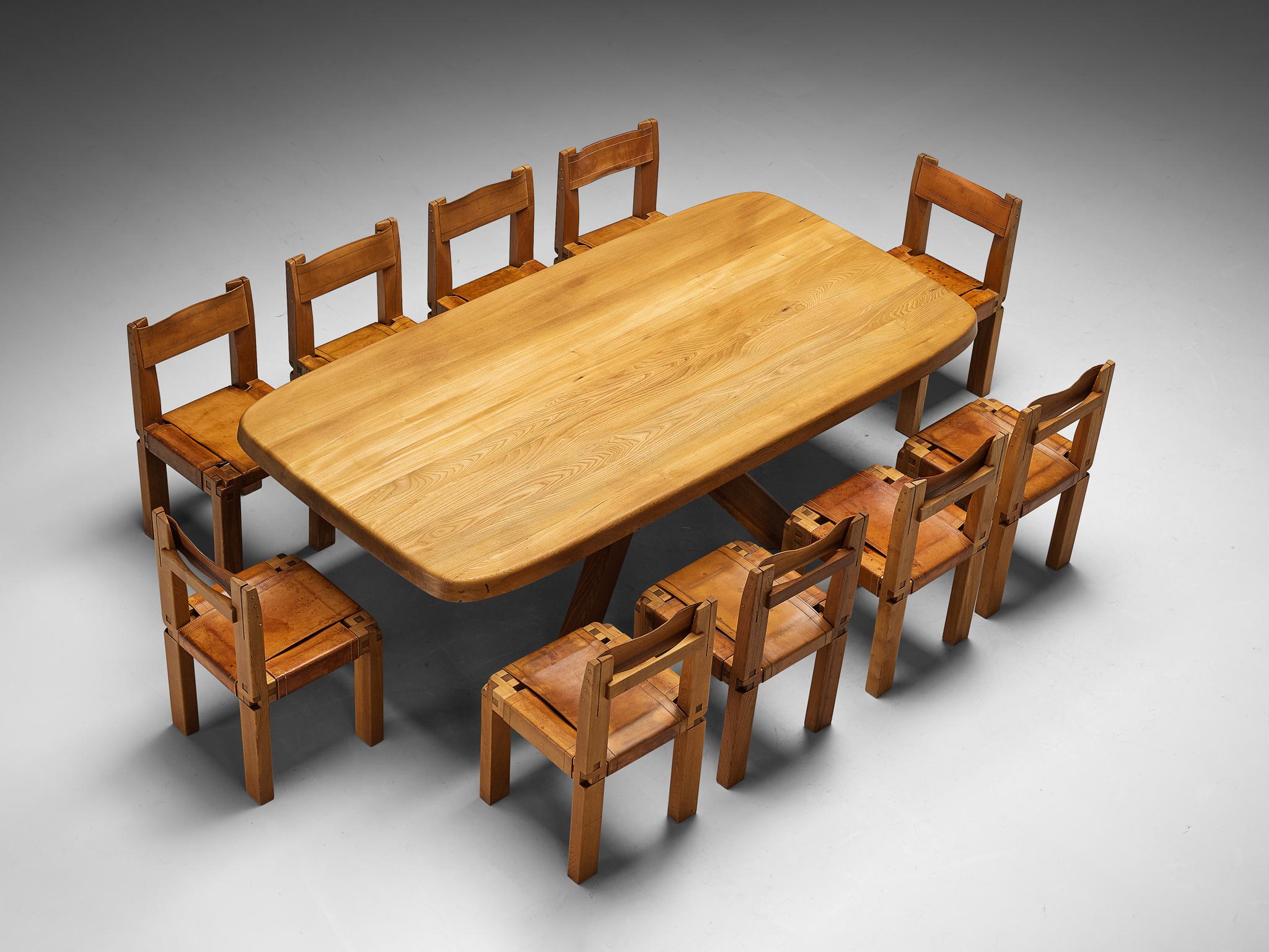 Dining room set consisting of ten S11 dining chairs with Aban T35D dining table by Pierre Chapo


Pierre Chapo, set of ten dining chairs, model 'S11', elm, leather, rope, France, circa 1978

This design is an early edition by Pierre Chapo. Crafted